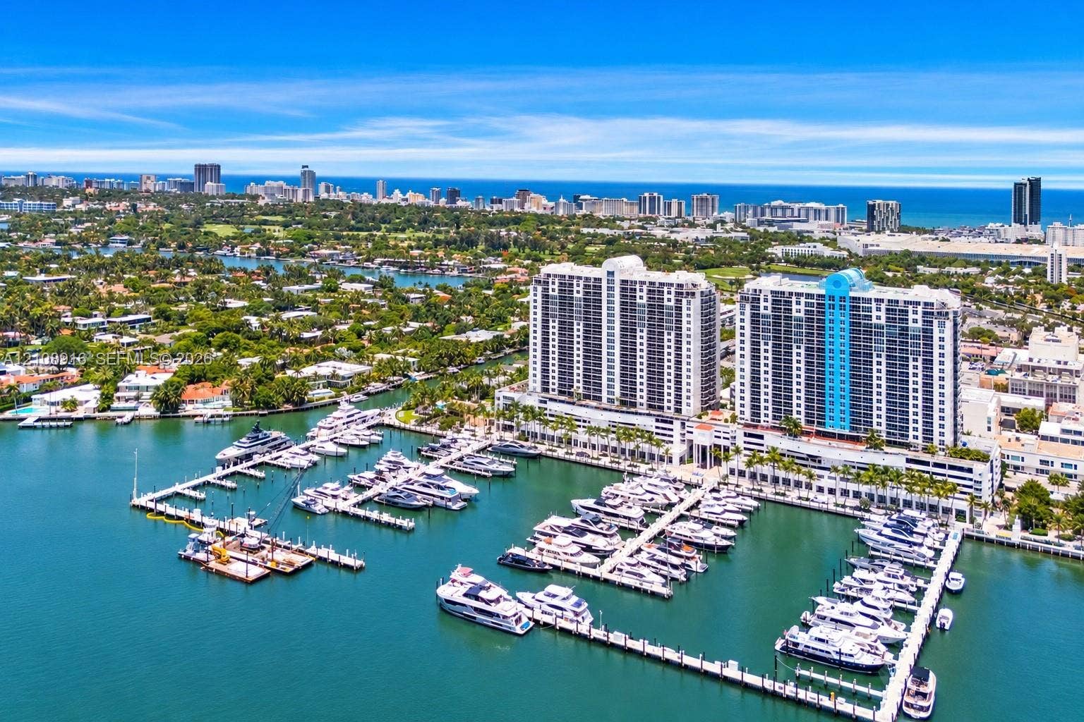Marina view of Sunset Harbour High-rise residential complex featuring extensive water frontage