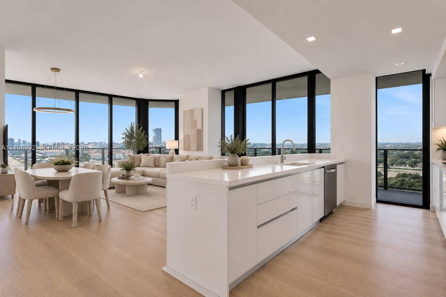 1170 E Hallandale Beach Boulevard, #1201, Hallandale Beach, FL 33009 Open-concept living space featuring floor-to-ceiling windows, wood-finish flooring, recessed lighting, and a kitchen island with stone countertops and stainless steel appliances