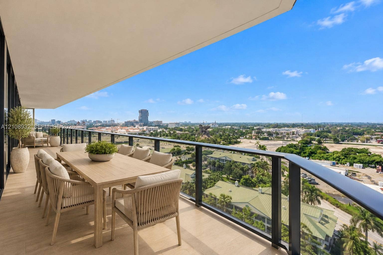 1170 E Hallandale Beach Boulevard, #1201, Hallandale Beach, FL 33009 Covered balcony featuring wood-finish flooring and a black metal railing