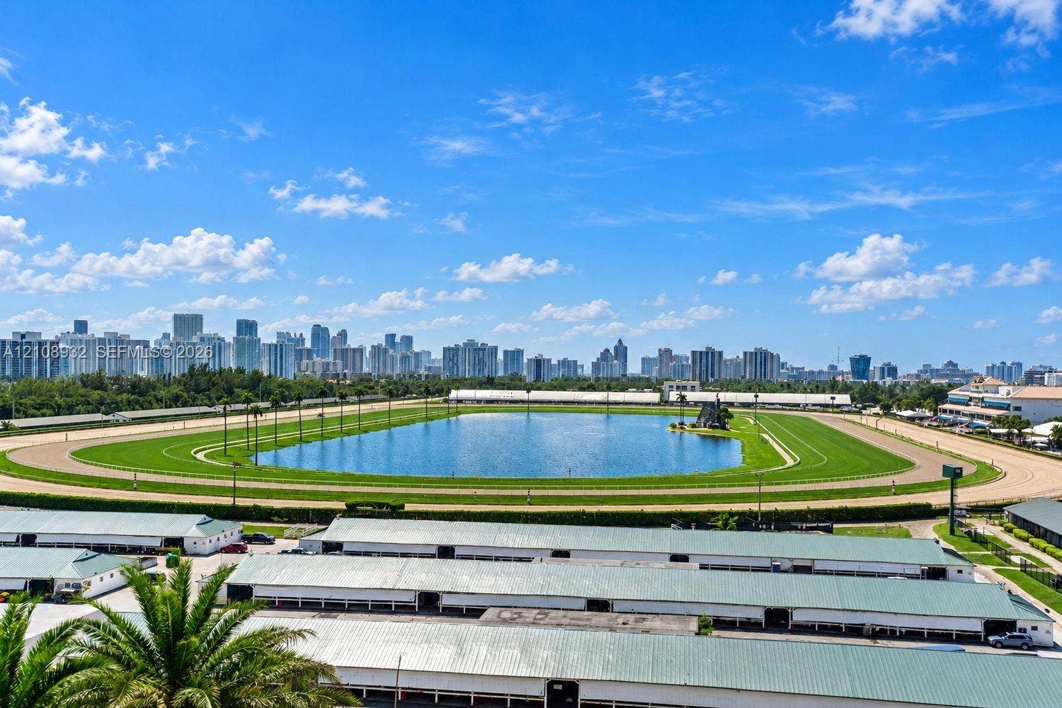 1170 E Hallandale Beach Boulevard, #1201, Hallandale Beach, FL 33009 Panoramic skyline outlook featuring a sprawling racetrack, central lake, and lush green grounds