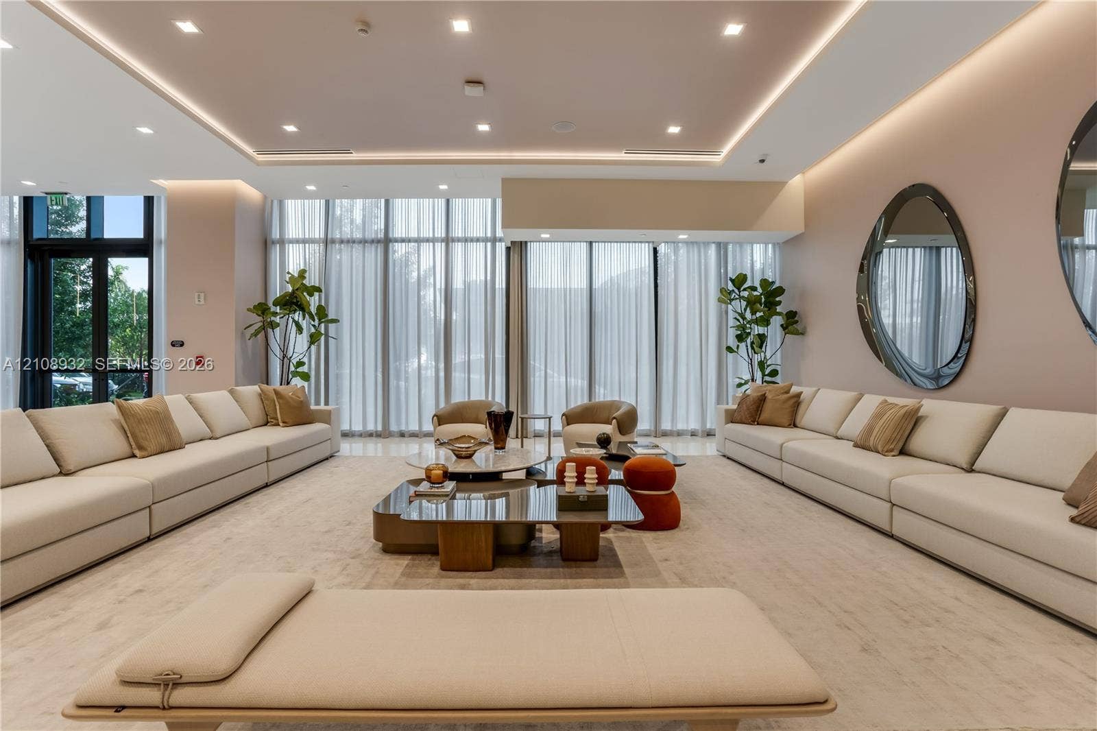 1170 E Hallandale Beach Boulevard, #1201, Hallandale Beach, FL 33009 Floor-to-ceiling windows with floor-length drapery, recessed tray ceiling with integrated cove lighting, recessed overhead lighting, and light-toned hard-surface flooring