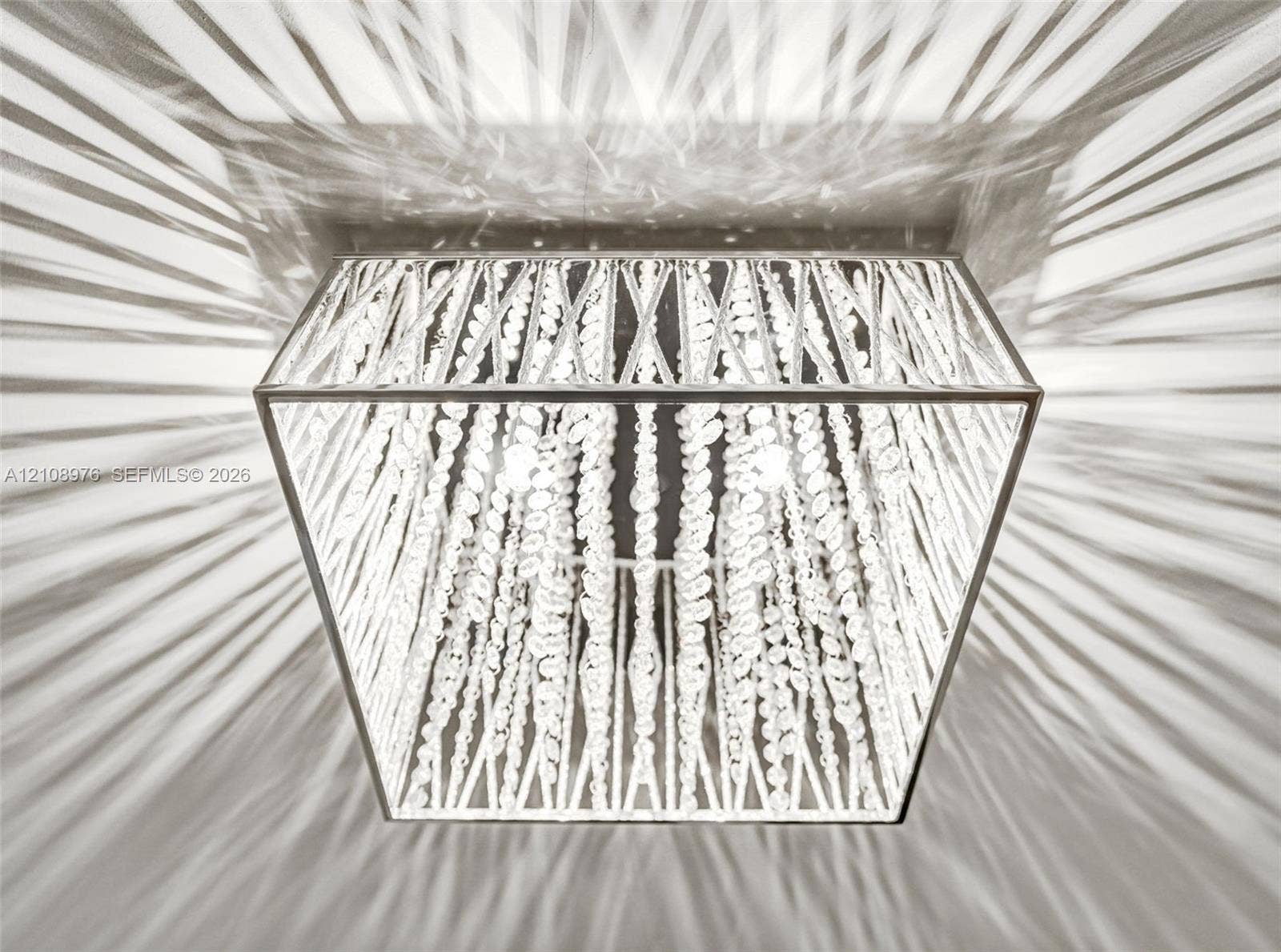 525 SW 12th Street, Fort Lauderdale, Fort Lauderdale, FL 33315 Square flush-mount ceiling fixture featuring a metallic frame and cascading crystal bead strands
