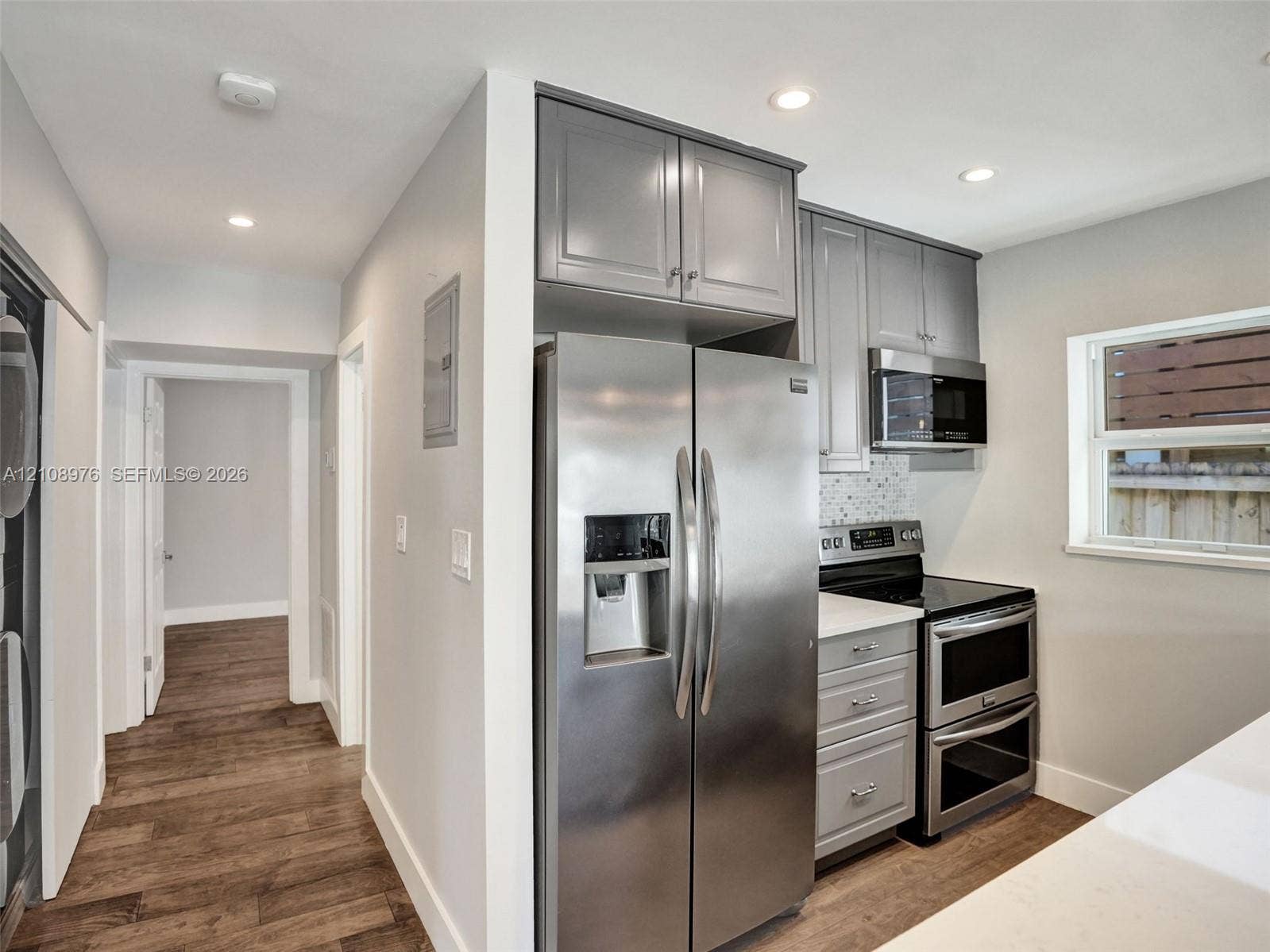 525 SW 12th Street, Fort Lauderdale, Fort Lauderdale, FL 33315 Kitchen featuring grey shaker-style cabinetry, stainless steel side-by-side refrigerator, double wall oven, quartz countertops, and recessed lighting