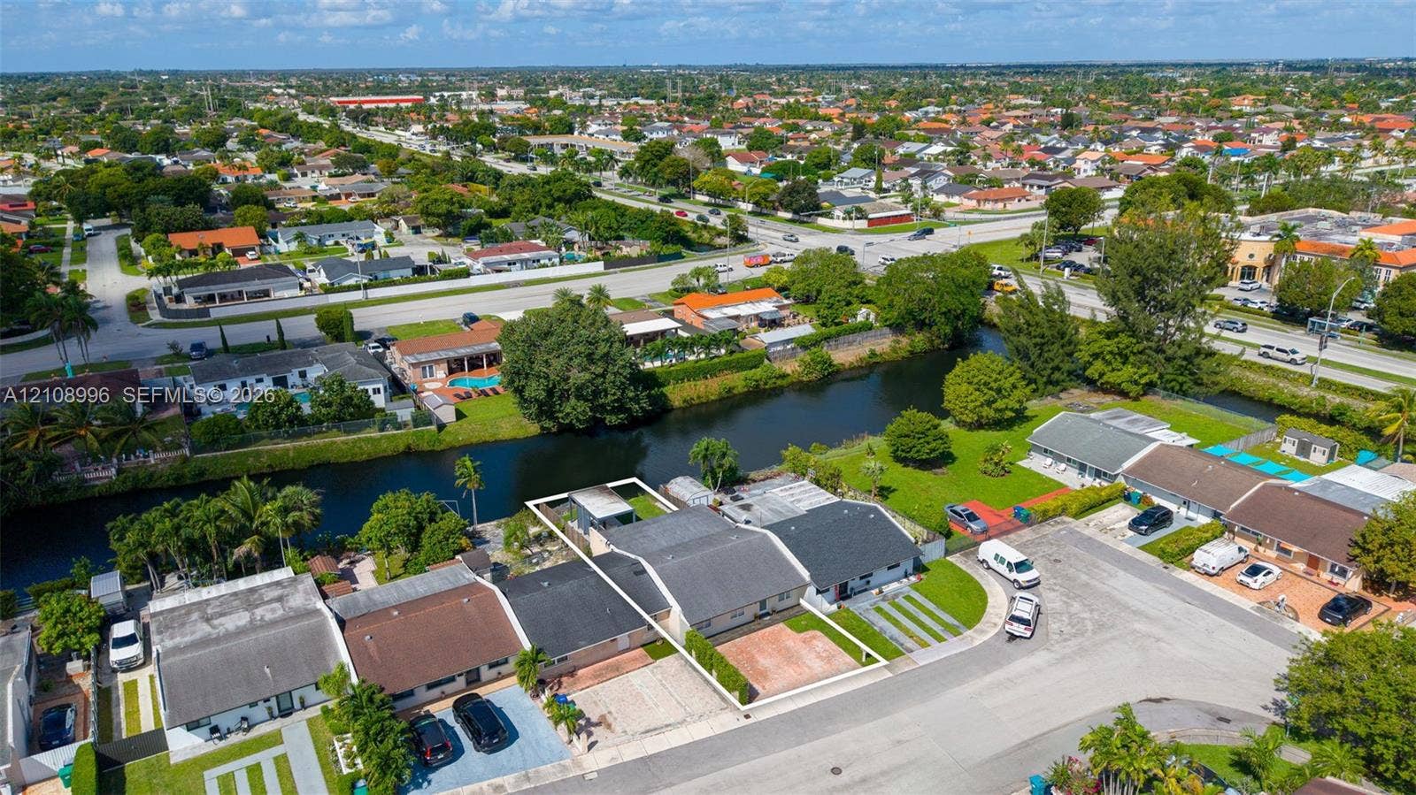 4252 SW 131st Avenue, Miami, FL 33175 Aerial perspective of a waterfront property featuring a paved driveway and direct canal access