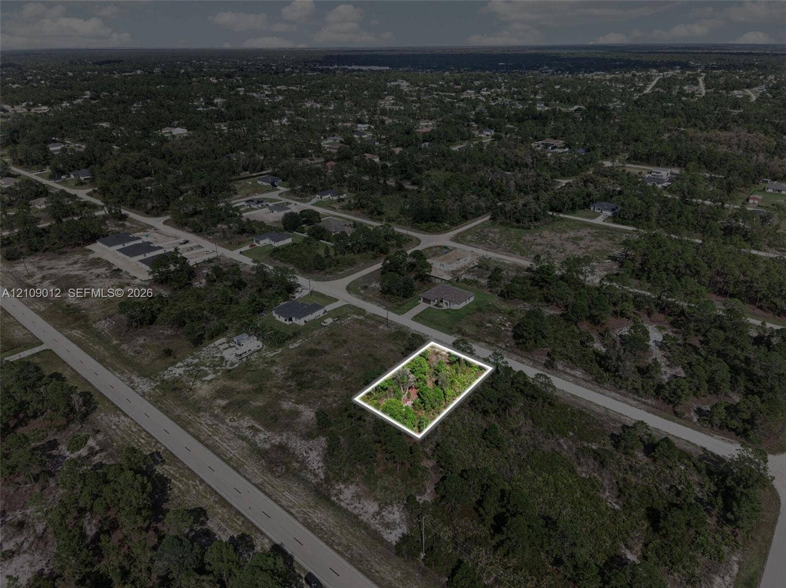 846 Burns Avenue S, Lehigh Acres, Lehigh Acres, FL 33974 Corner lot situated in a partially developed area featuring native vegetation and direct paved road frontage