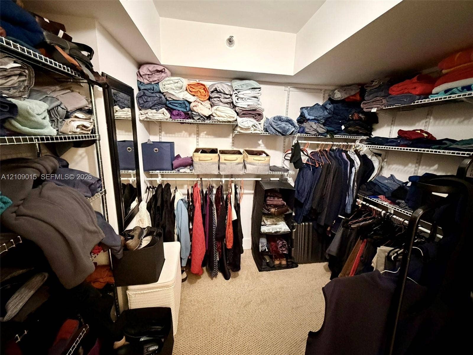 3530 Mystic Pointe Drive, #1709, Aventura, FL 33180 Walk-in storage space featuring multi-level wire shelving and carpeted flooring