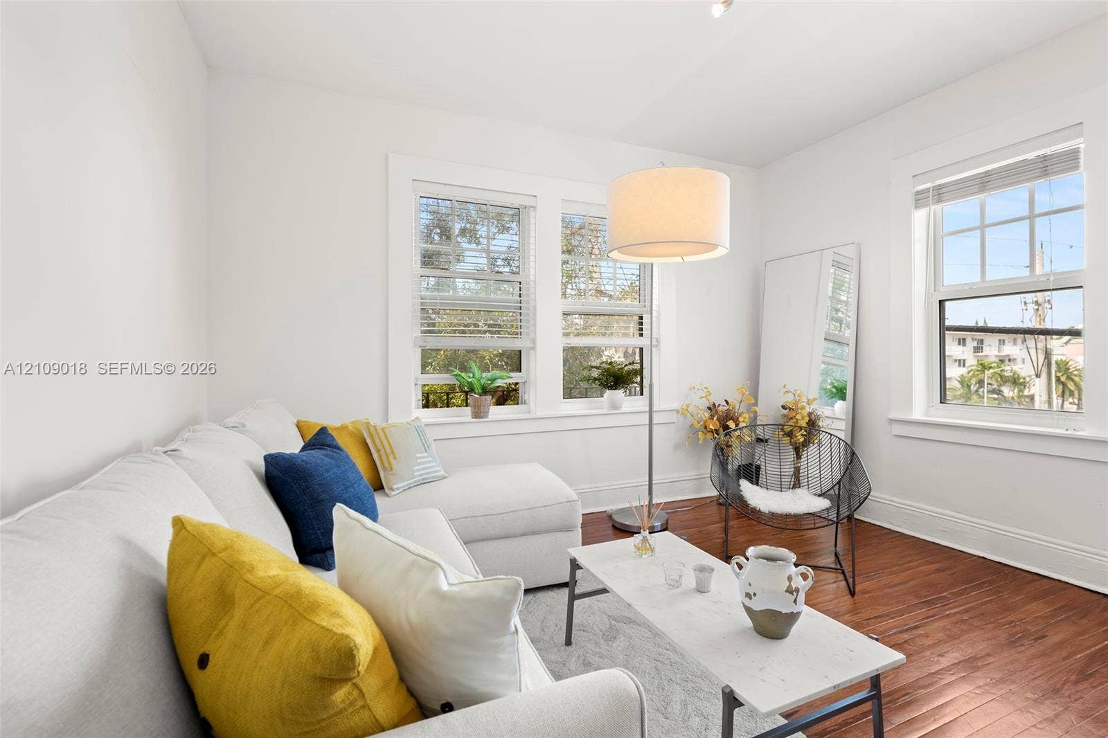 536 14th Street, #305, Miami Beach, Miami Beach, FL 33139 Interior space featuring wood-finish flooring, multi-pane windows, and white wall finishes
