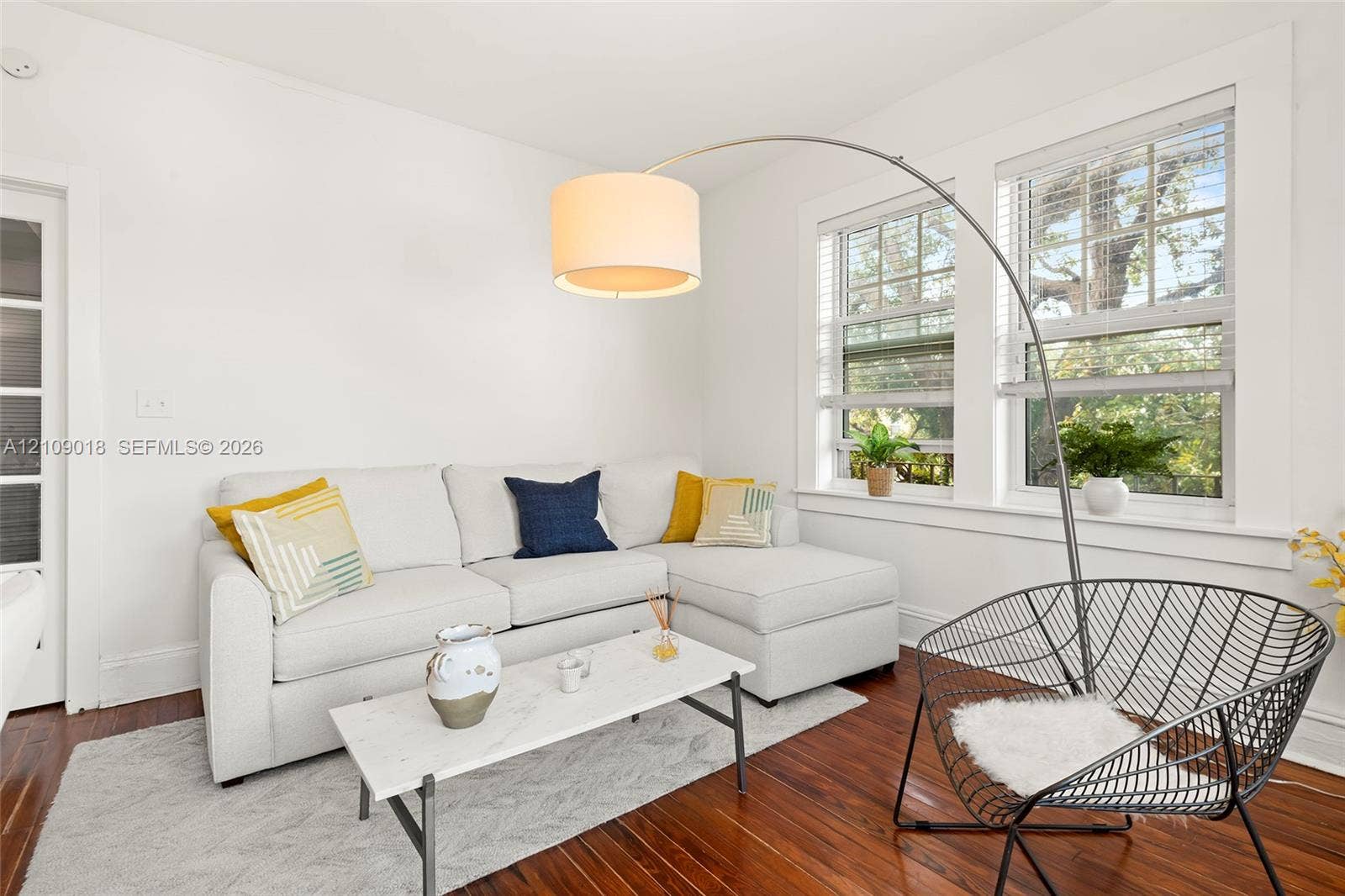 536 14th Street, #305, Miami Beach, Miami Beach, FL 33139 Wood-finish flooring, multi-pane windows with white trim, and a glass-paneled door