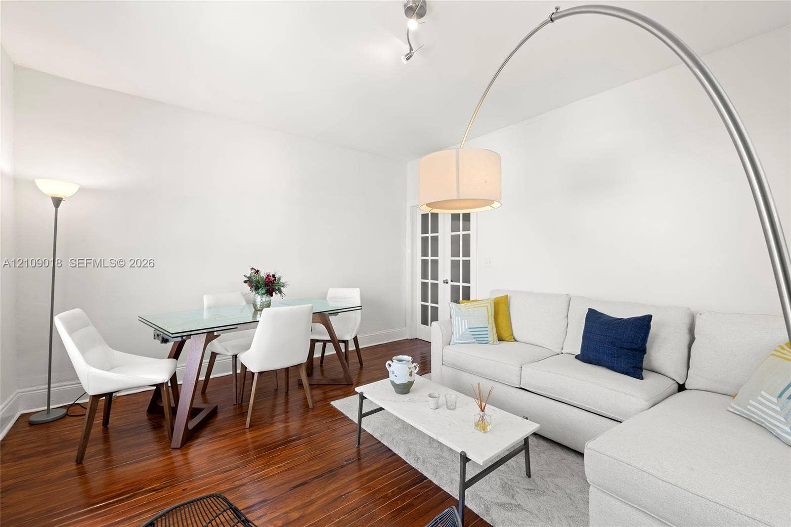 536 14th Street, #305, Miami Beach, Miami Beach, FL 33139 Wood-finish flooring, white walls, and French doors featuring glass panes