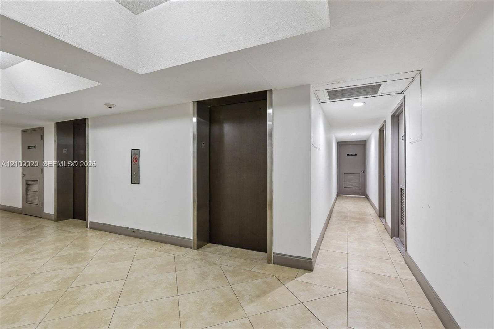 701 NW 19th Street, #300, Fort Lauderdale, FL 33311 Elevator lobby featuring tile flooring, metal elevator doors, and recessed lighting