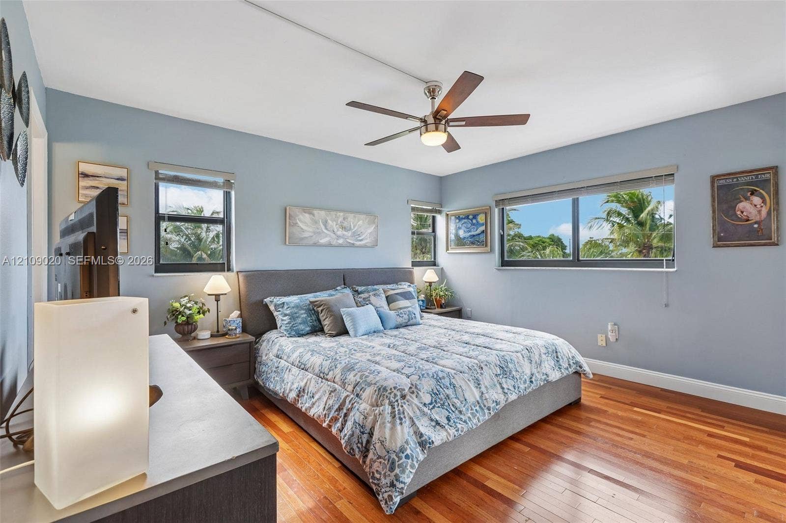 701 NW 19th Street, #300, Fort Lauderdale, FL 33311 Wood-finish flooring, multi-pane windows with horizontal blinds, and a multi-blade ceiling fan with integrated lighting