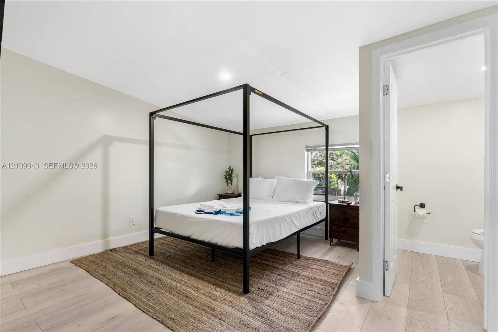 605 SW 17th Street, #1-3, Fort Lauderdale, Fort Lauderdale, FL 33315 Neutral-toned interior featuring wood-finish flooring, recessed lighting, and a window with exterior greenery