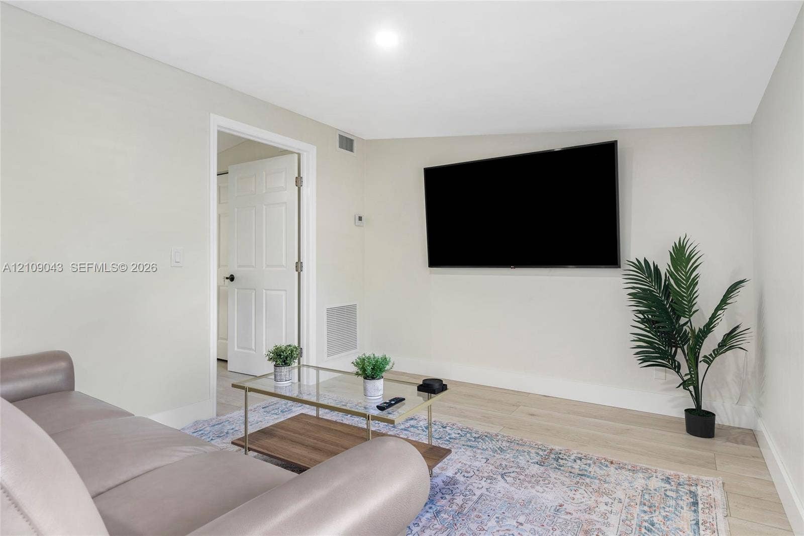 605 SW 17th Street, #1-3, Fort Lauderdale, Fort Lauderdale, FL 33315 Neutral interior featuring wood-finish flooring, recessed lighting, and a six-panel interior door