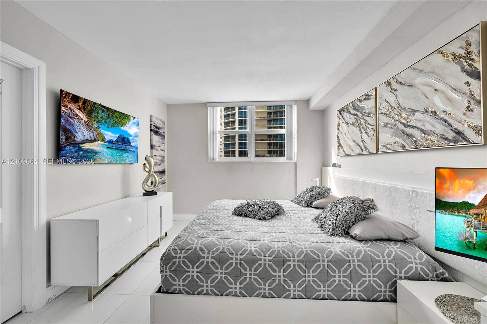 Neutral-toned room with polished light-reflective flooring, crisp white walls, and a multi-pane window
