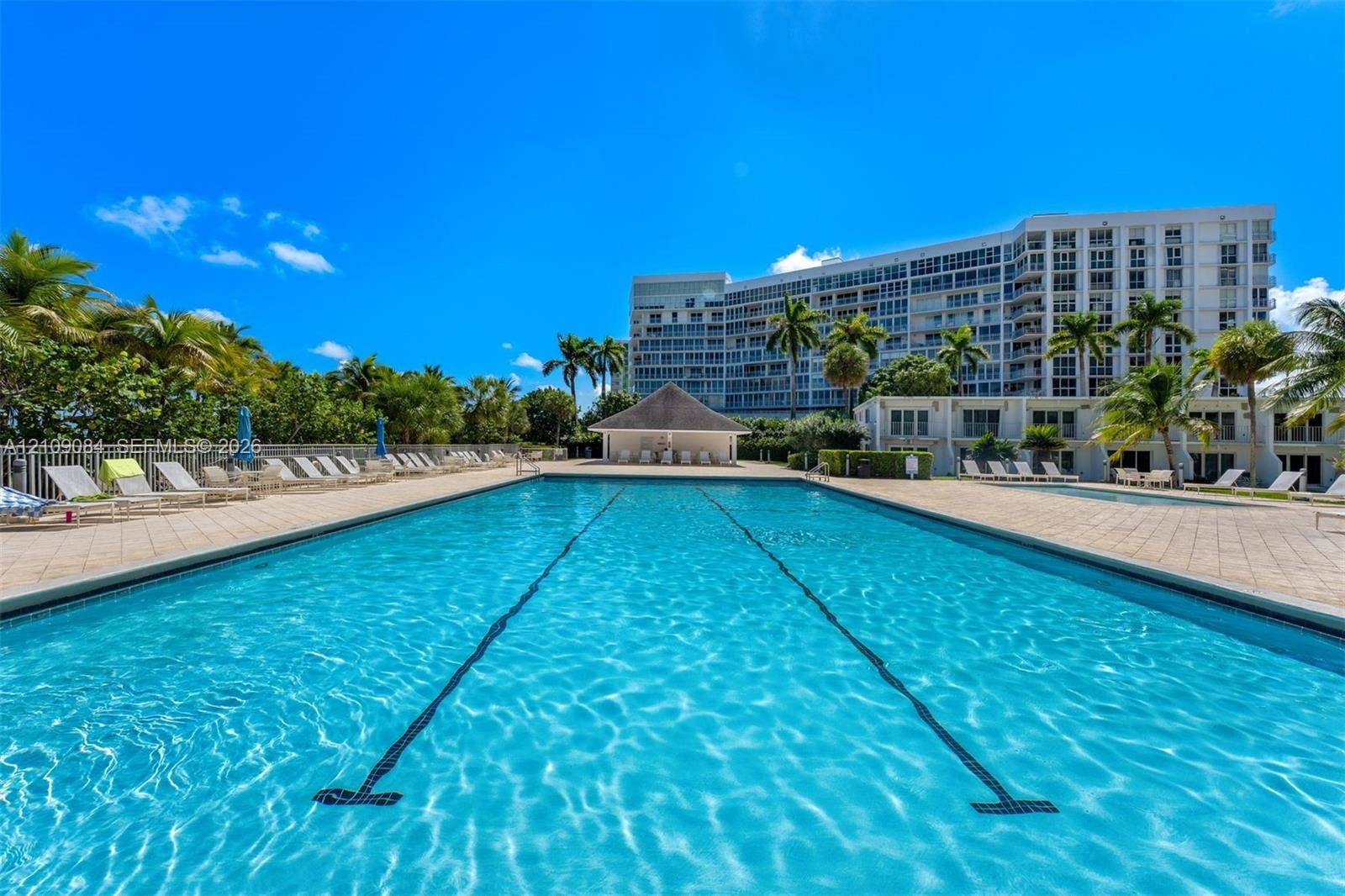 Direct oceanfront access featuring a sandy shoreline and expansive water horizon