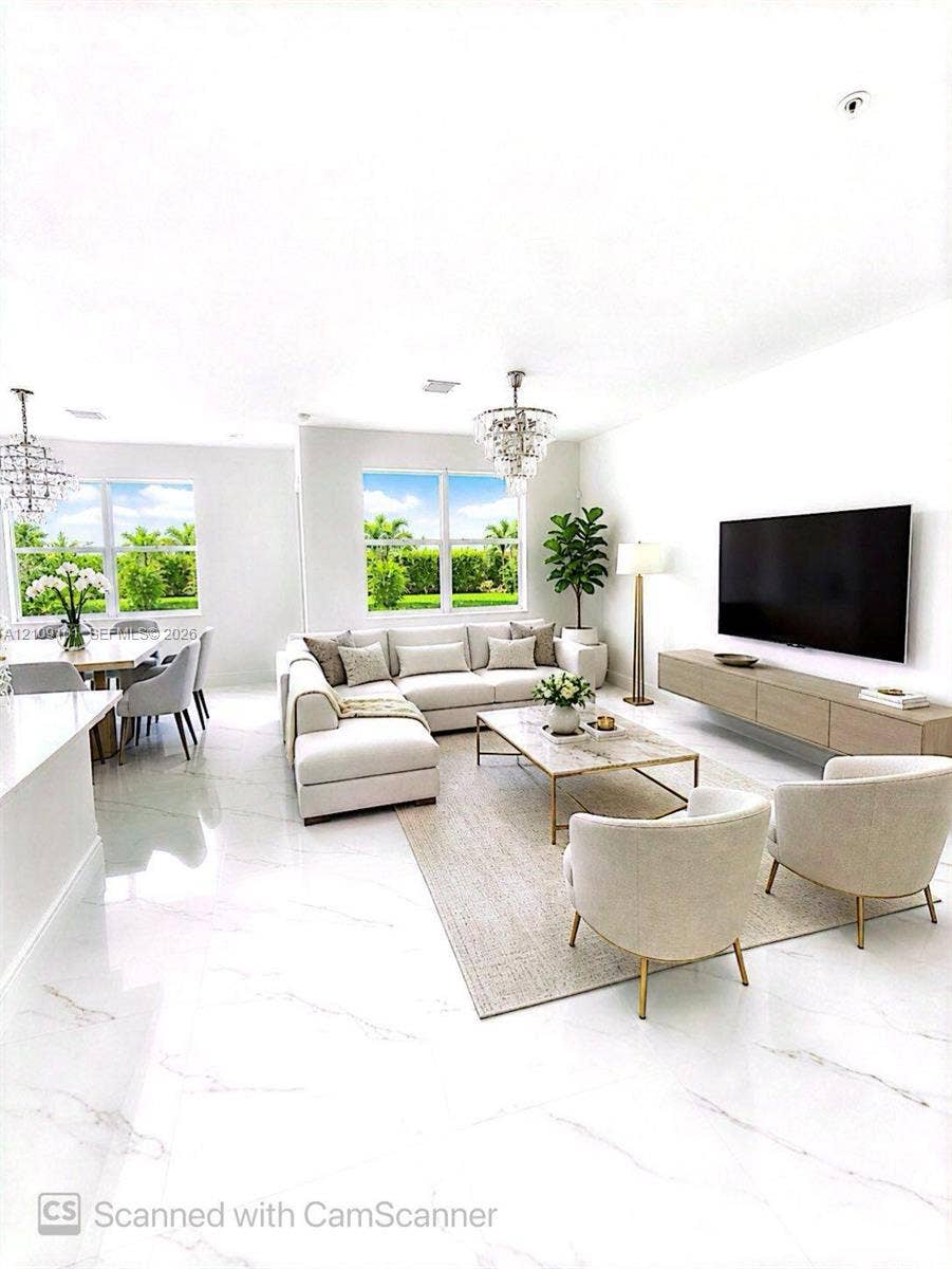 Large-format porcelain tile flooring with marble-style veining, wall-mounted floating media console, and dual crystal-accented chandeliers