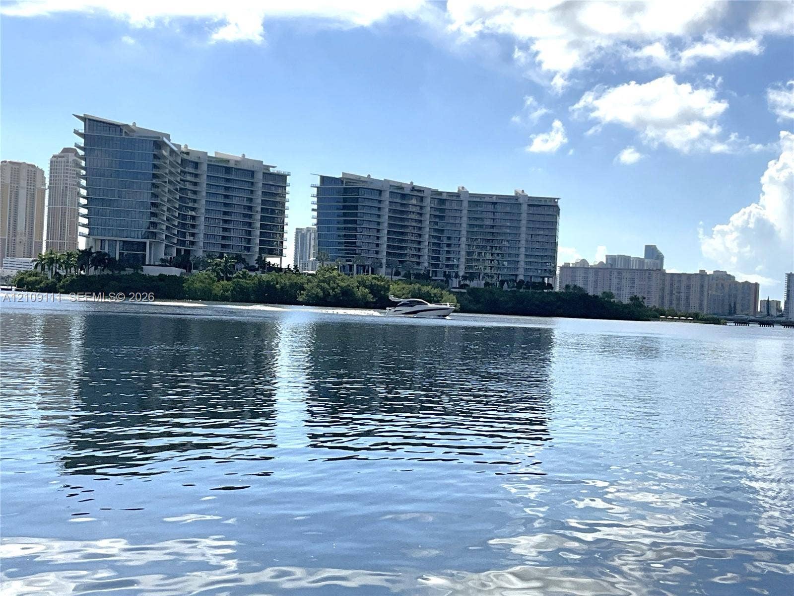 3370 Hidden Bay Drive, #801, Aventura, FL 33180 Waterfront location featuring expansive coastal horizons and multi-story high-rise structures