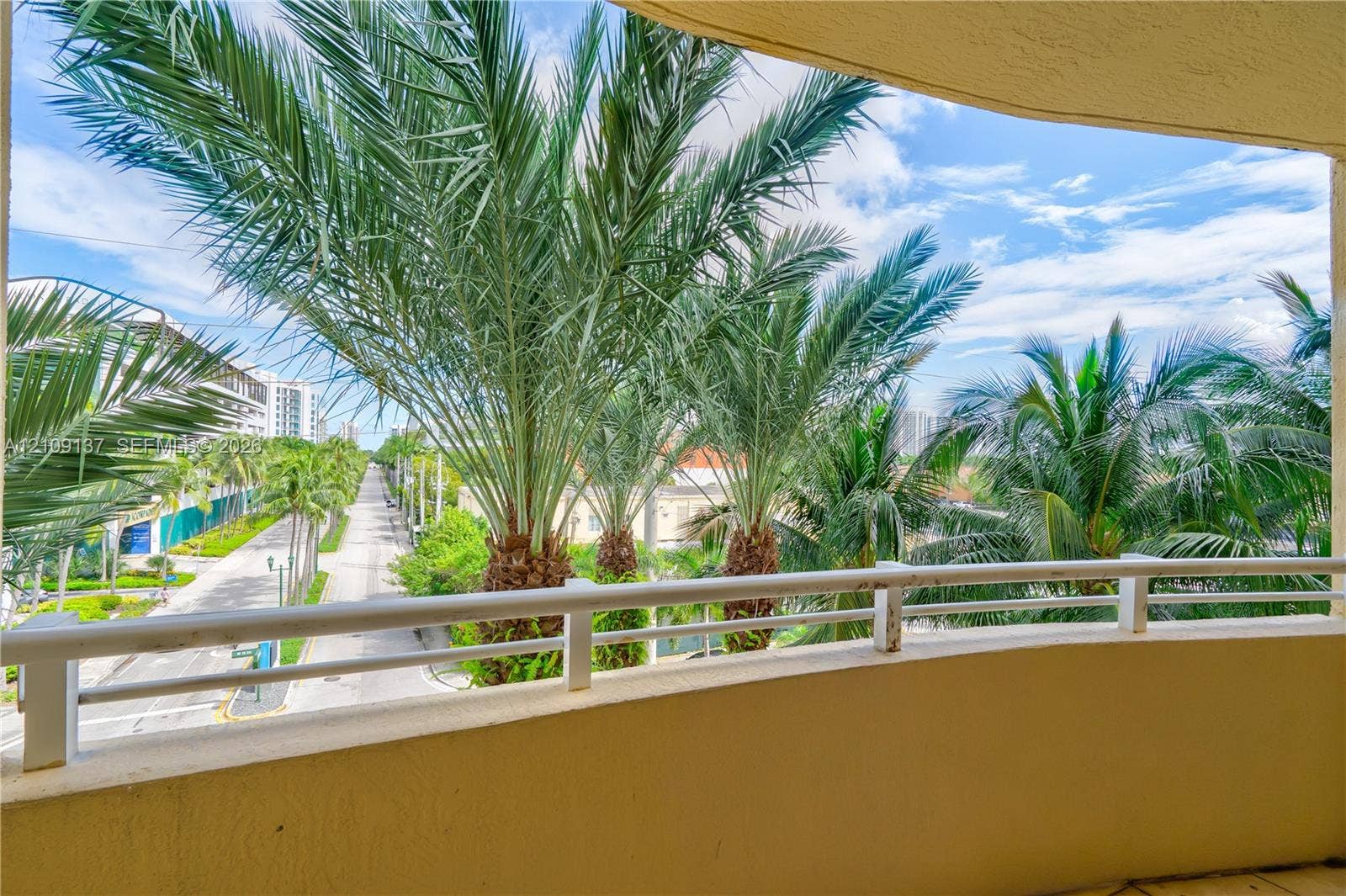 18800 NE 29th Avenue, #411, Aventura, FL 33180 Covered balcony featuring a white metal railing and tile flooring