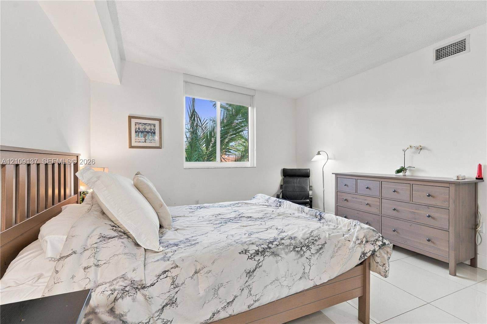 18800 NE 29th Avenue, #411, Aventura, FL 33180 Spacious room featuring neutral wall tones, large-format tile flooring, and a single-pane sliding window