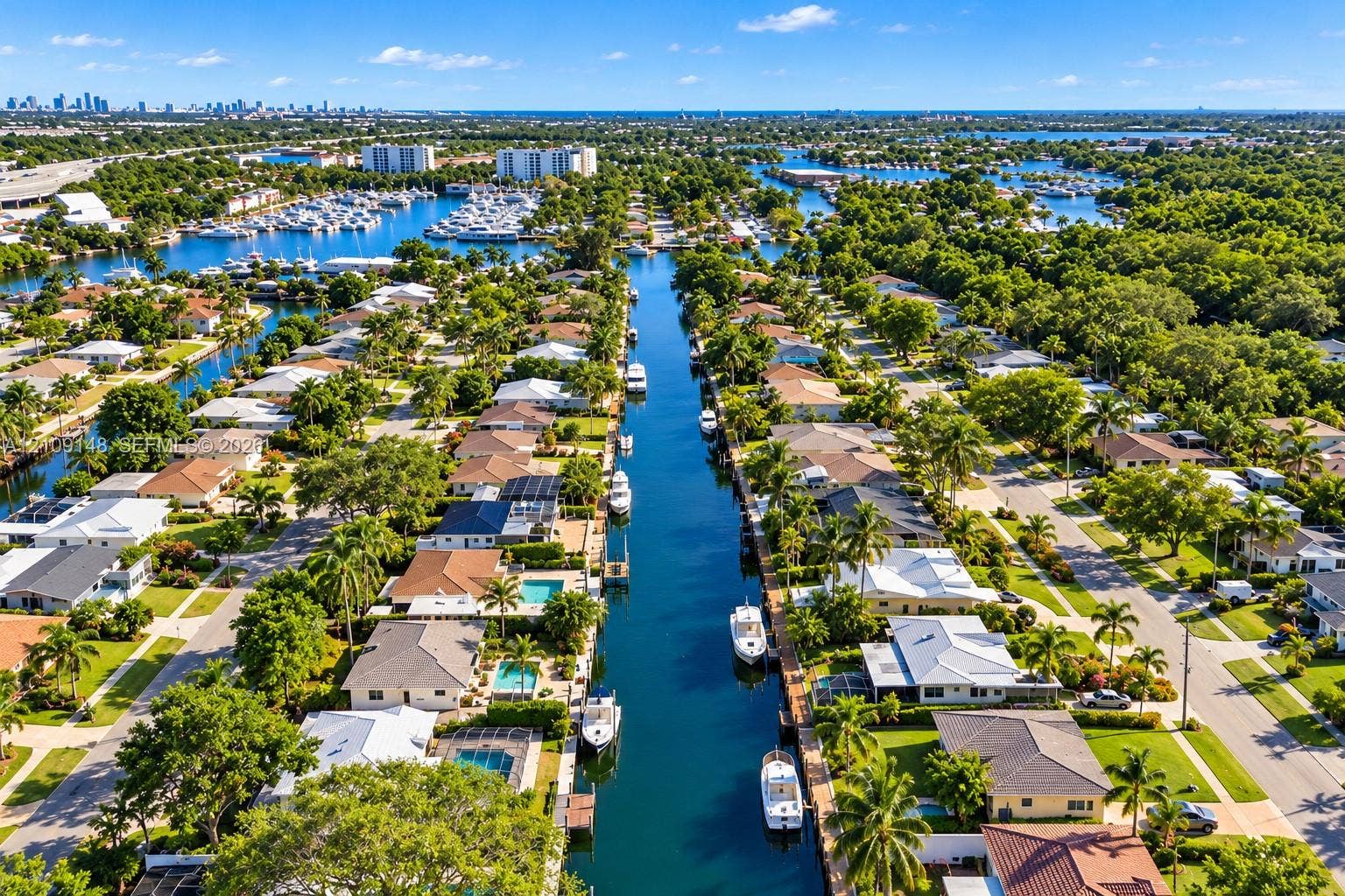 1701 SW 23rd Avenue, Fort Lauderdale, FL 33312 Aerial perspective of a waterfront residential neighborhood featuring deep-water canal access, private boat docks, and established coastal landscaping