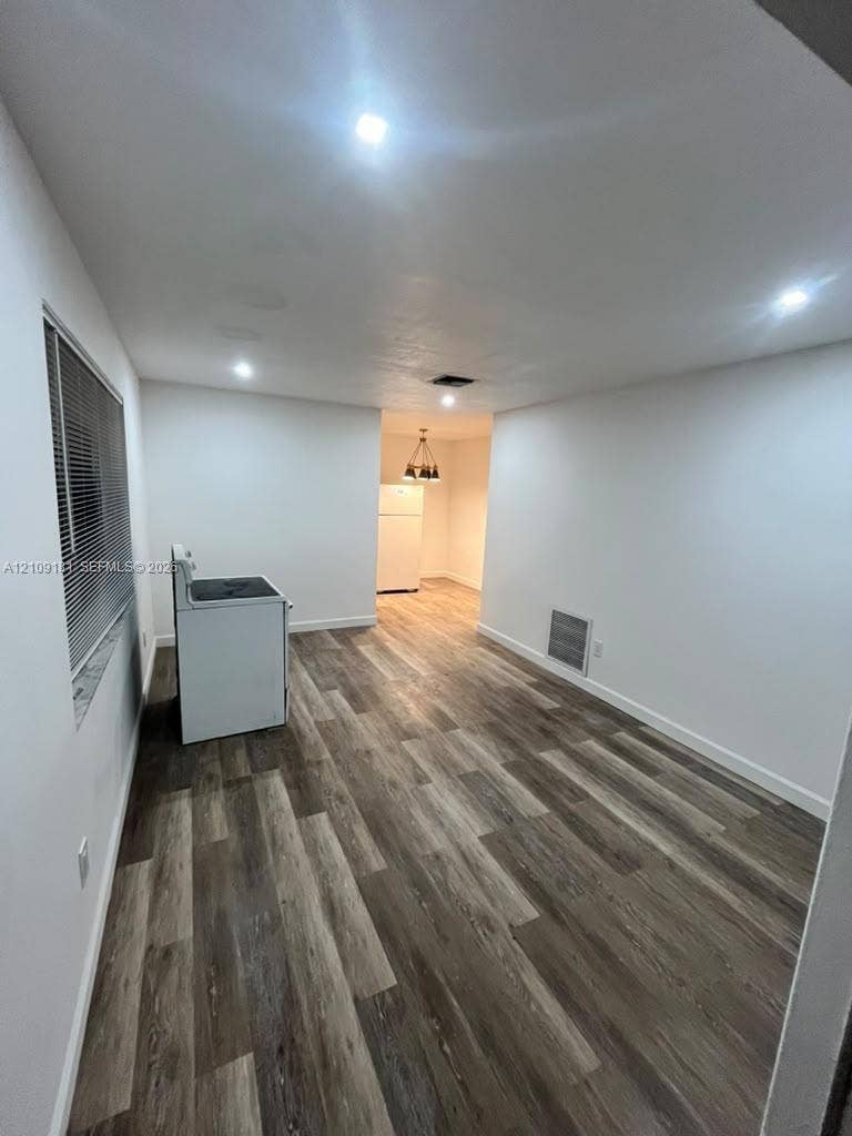 727 SW 10th Street, #1, Hallandale Beach, Hallandale Beach, FL 33009 Wood-finish flooring, recessed lighting, and white walls throughout the interior
