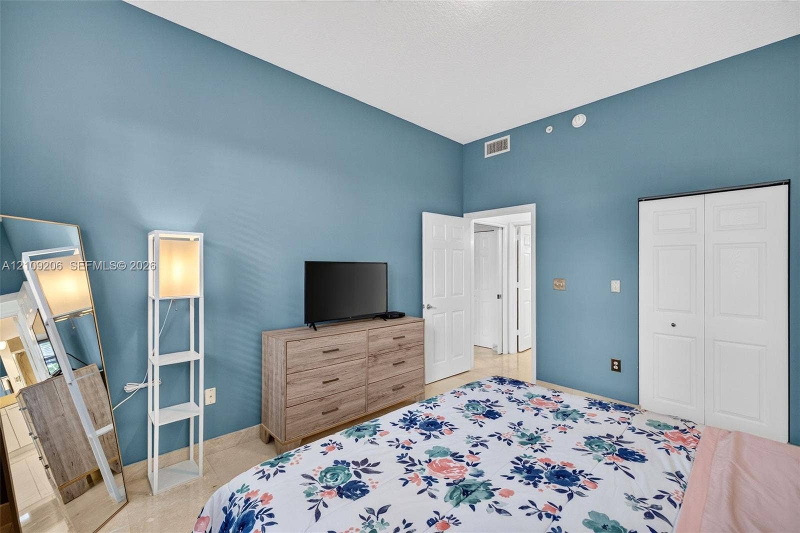 2080 S Ocean Drive, #112, Hallandale Beach, Hallandale Beach, FL 33009 Room featuring high ceilings, light-tone tile flooring, and dual-panel closet doors