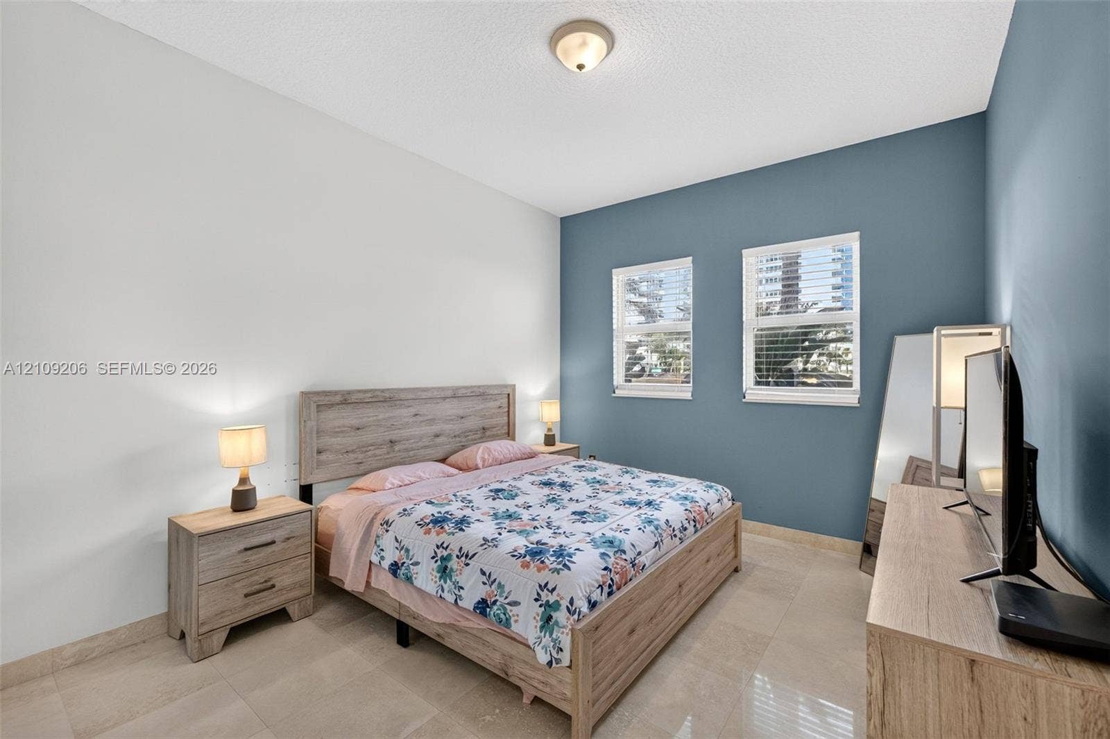 2080 S Ocean Drive, #112, Hallandale Beach, Hallandale Beach, FL 33009 Neutral-toned tile flooring, dual-tone wall finish, and two double-hung windows with integrated blinds