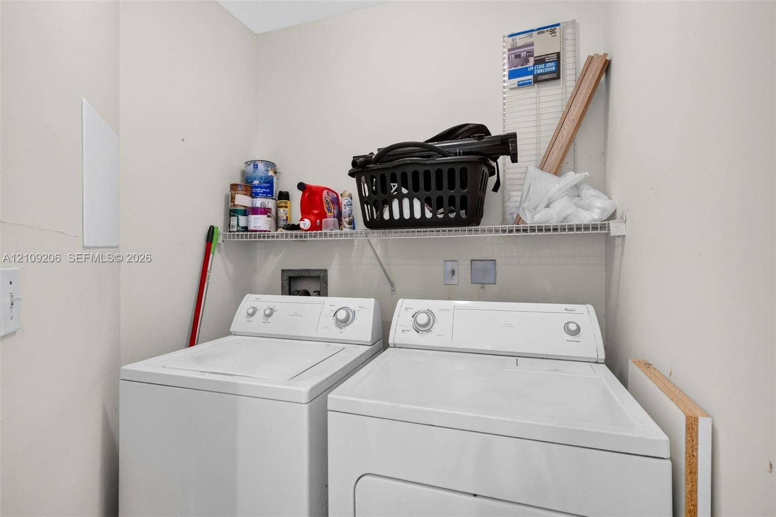 2080 S Ocean Drive, #112, Hallandale Beach, Hallandale Beach, FL 33009 Dedicated laundry area featuring a white wire shelving unit and hookups for appliances