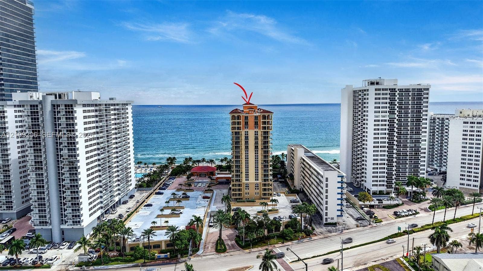 2080 S Ocean Drive, #112, Hallandale Beach, Hallandale Beach, FL 33009 High-rise residential structure featuring multi-level balconies, an arched roofline, and direct oceanfront positioning