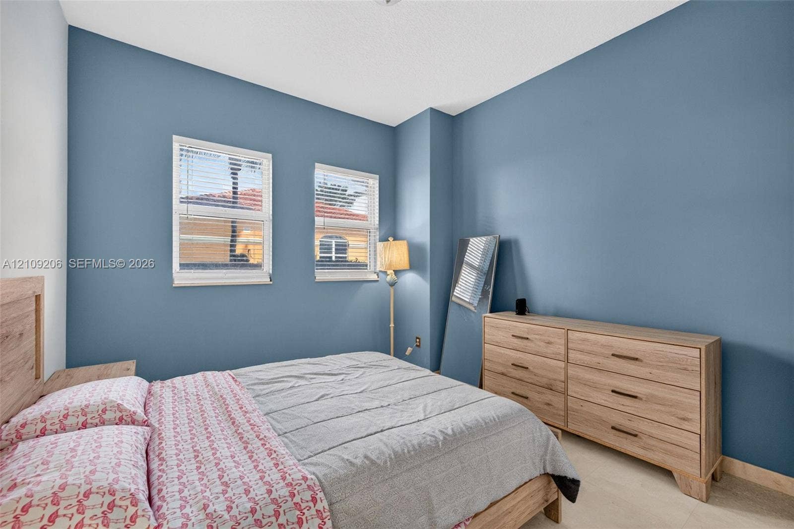 2080 S Ocean Drive, #112, Hallandale Beach, Hallandale Beach, FL 33009 Spacious room featuring dual-pane windows, neutral-toned tile flooring, and a crisp, matte-finish wall treatment