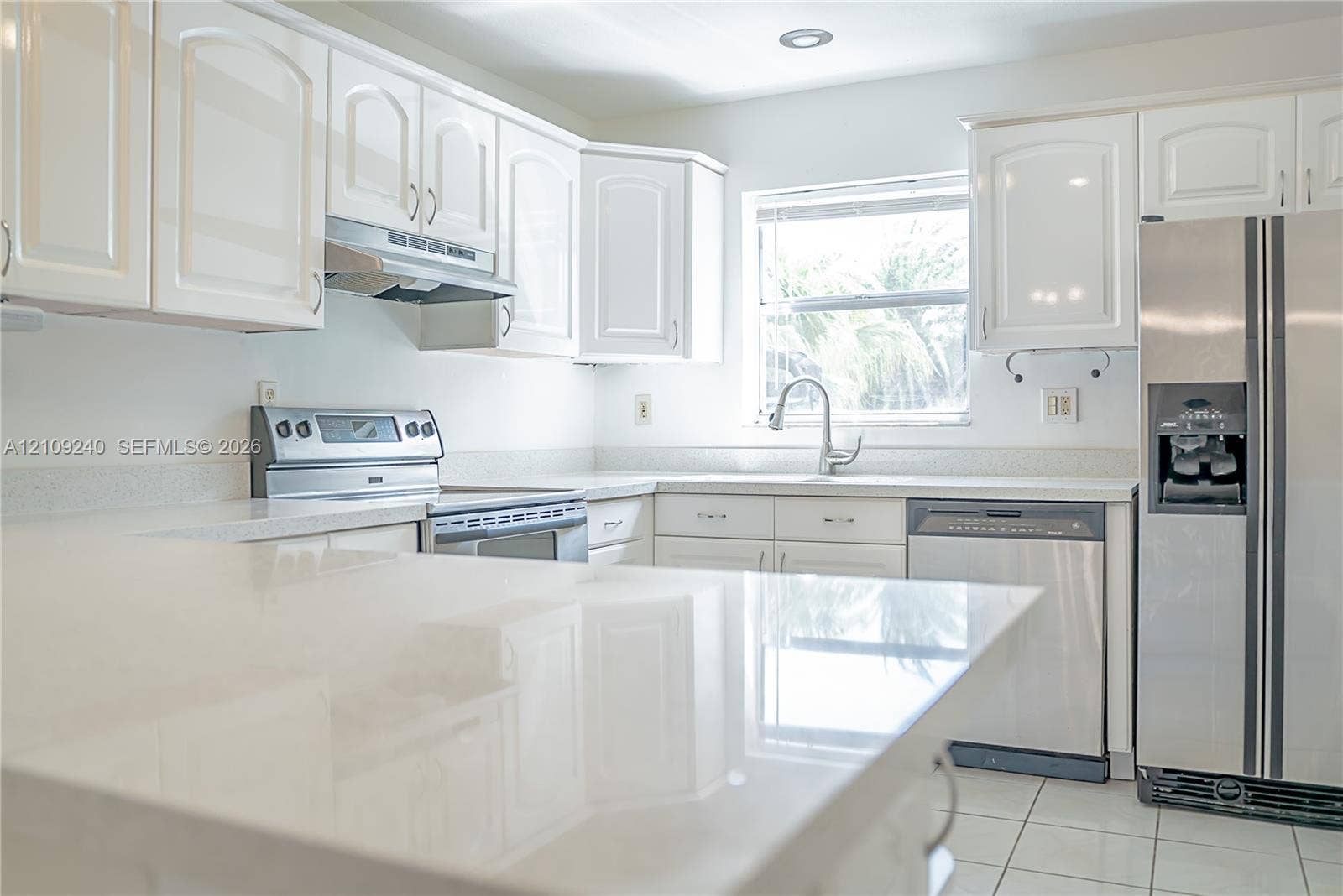 21115 SW 125th Ct Road, Miami, Miami, FL 33177 Kitchen featuring white cabinetry, solid-surface countertops, stainless steel appliances, and tile flooring