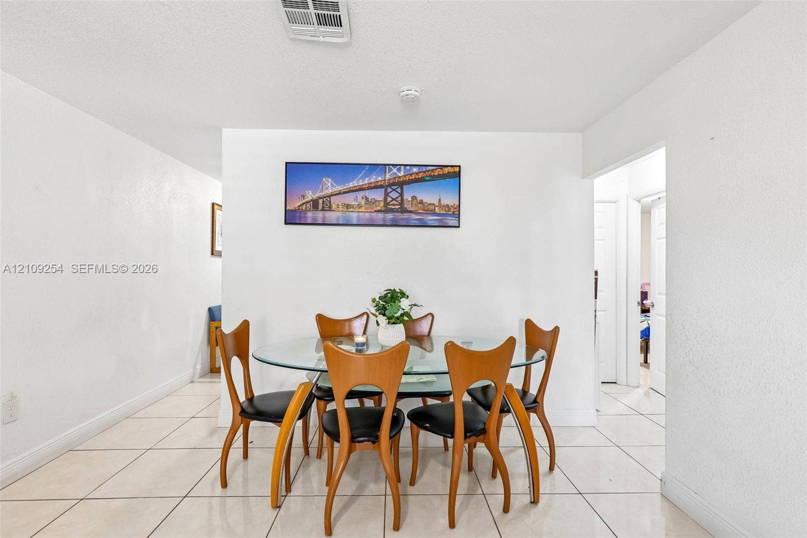 21342 NW 40th Cir Court, Miami Gardens, FL 33055 Large-format ceramic floor tiling throughout the space, punctuated by smooth wall surfaces and recessed ceiling lighting