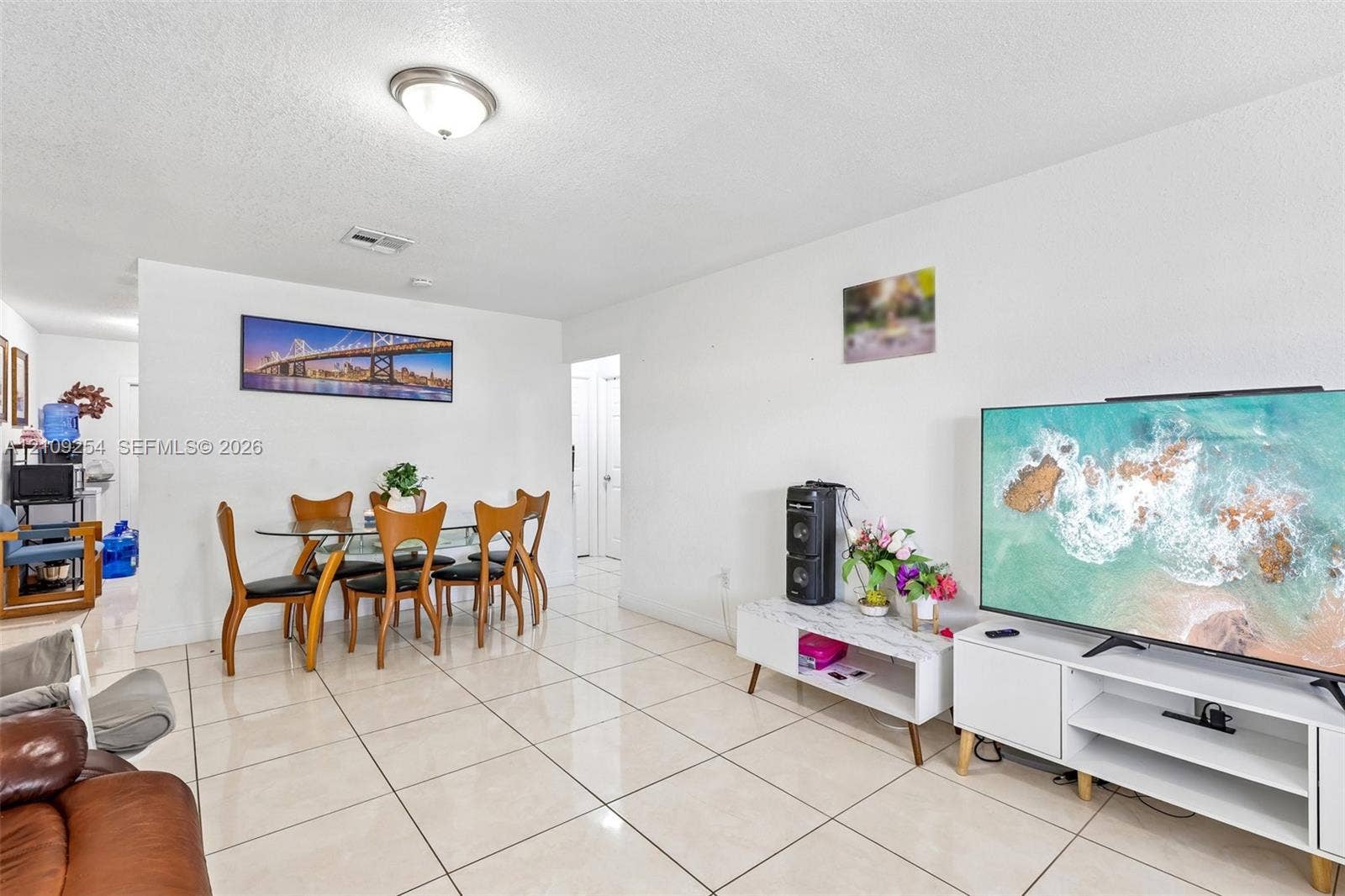 21342 NW 40th Cir Court, Miami Gardens, FL 33055 Neutral-toned tile flooring throughout an open-concept living area featuring a central dome light fixture