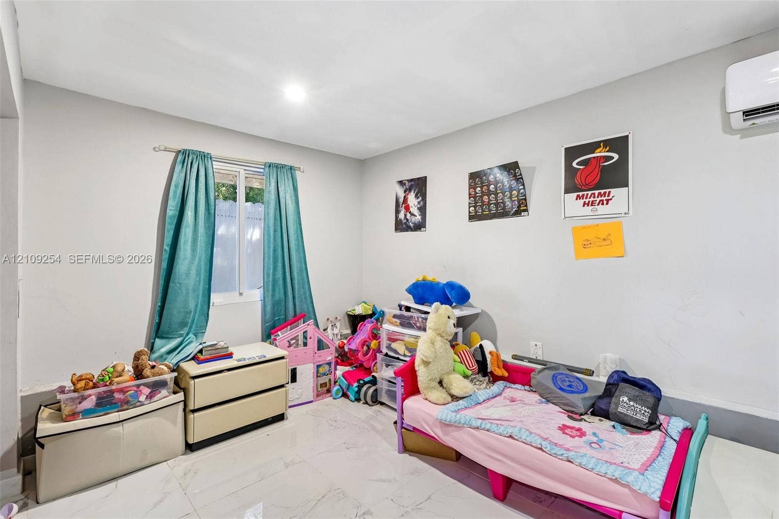 21342 NW 40th Cir Court, Miami Gardens, FL 33055 Neutral interior featuring polished large-format tile flooring, recessed ceiling lighting, and a wall-mounted ductless air conditioning unit