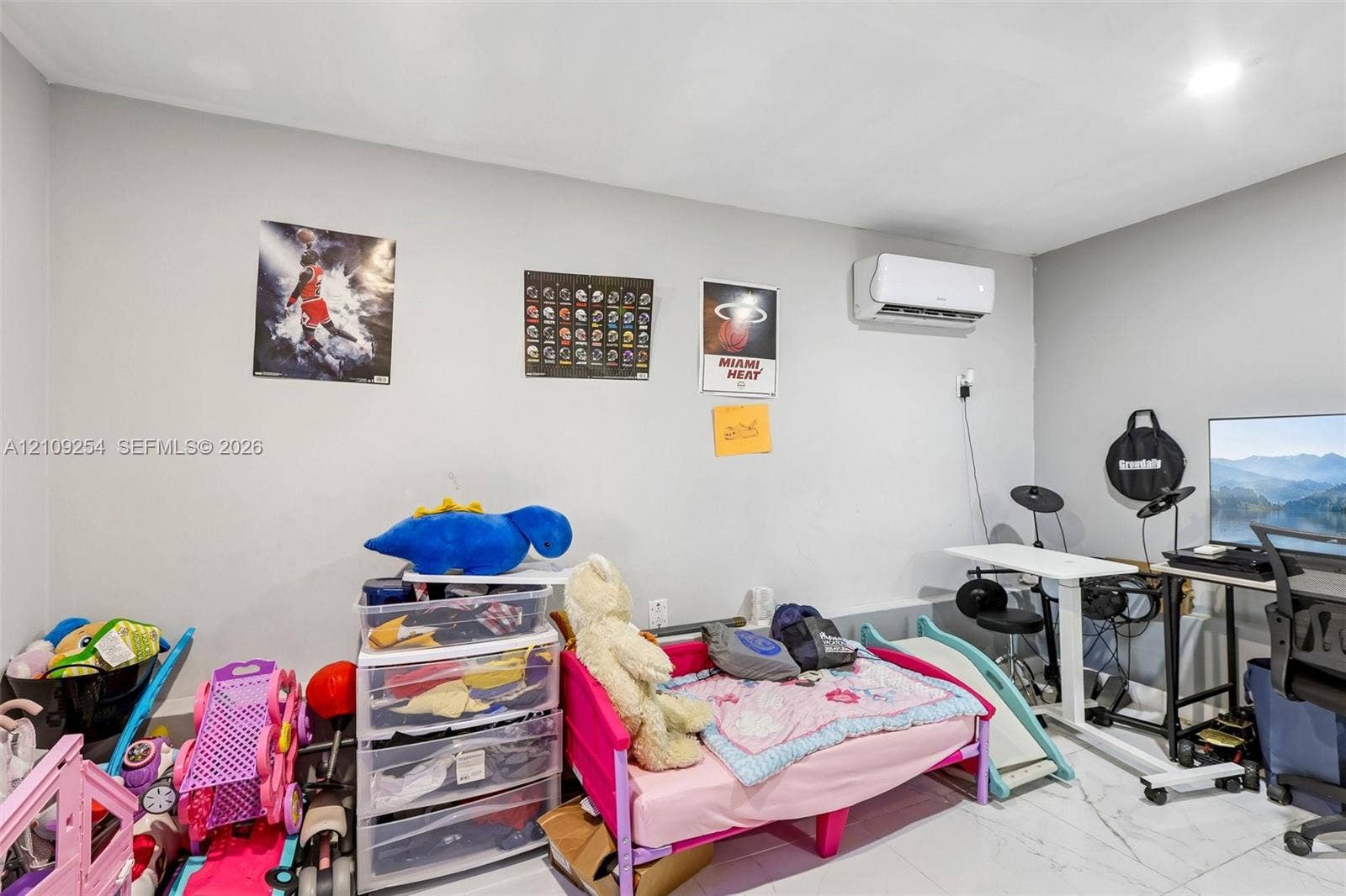 21342 NW 40th Cir Court, Miami Gardens, FL 33055 Interior room featuring neutral wall paint, polished tile flooring, and a wall-mounted ductless air conditioning unit