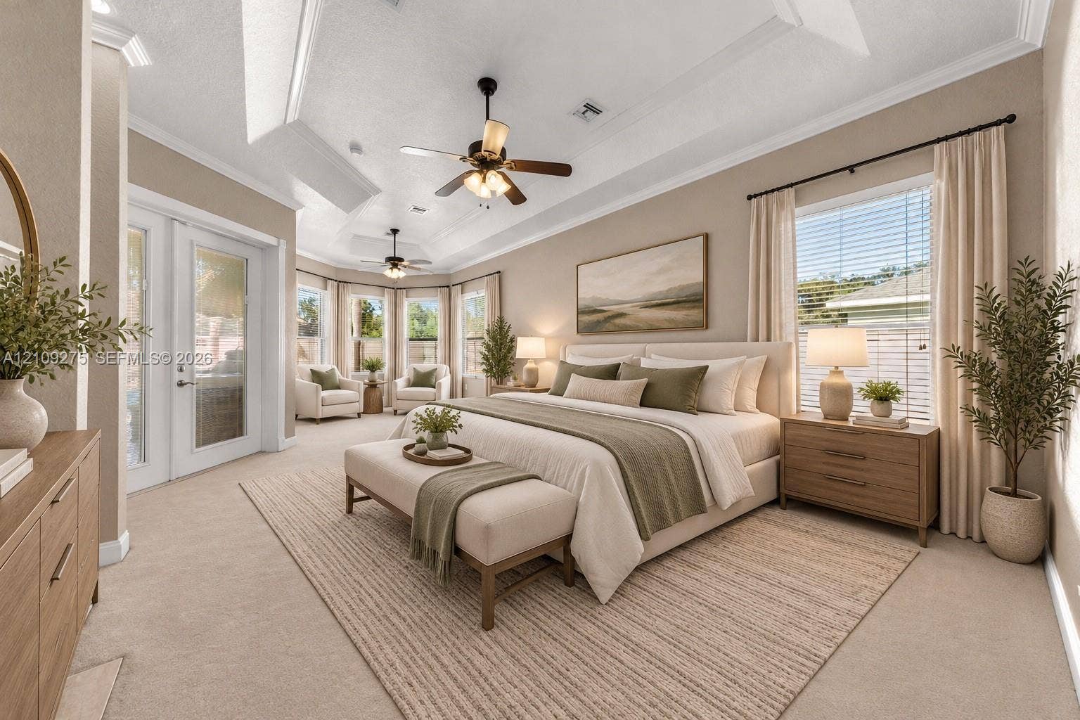 1035 SW 33rd Place, Ocala, FL 34471 Tray ceiling, dual ceiling fans, recessed lighting, and expansive windows featuring glass door access to the exterior