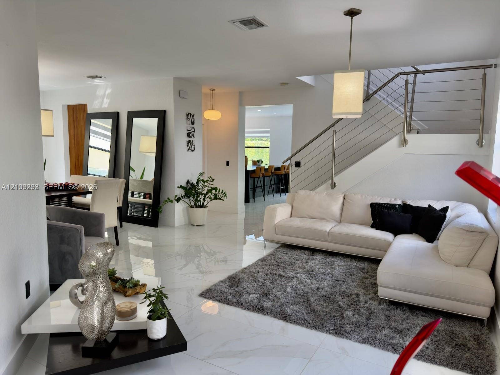 8880 NW 115th Court, Doral, FL 33178 Polished tile flooring, recessed lighting, and a cable-railing staircase featuring a sleek metal handrail