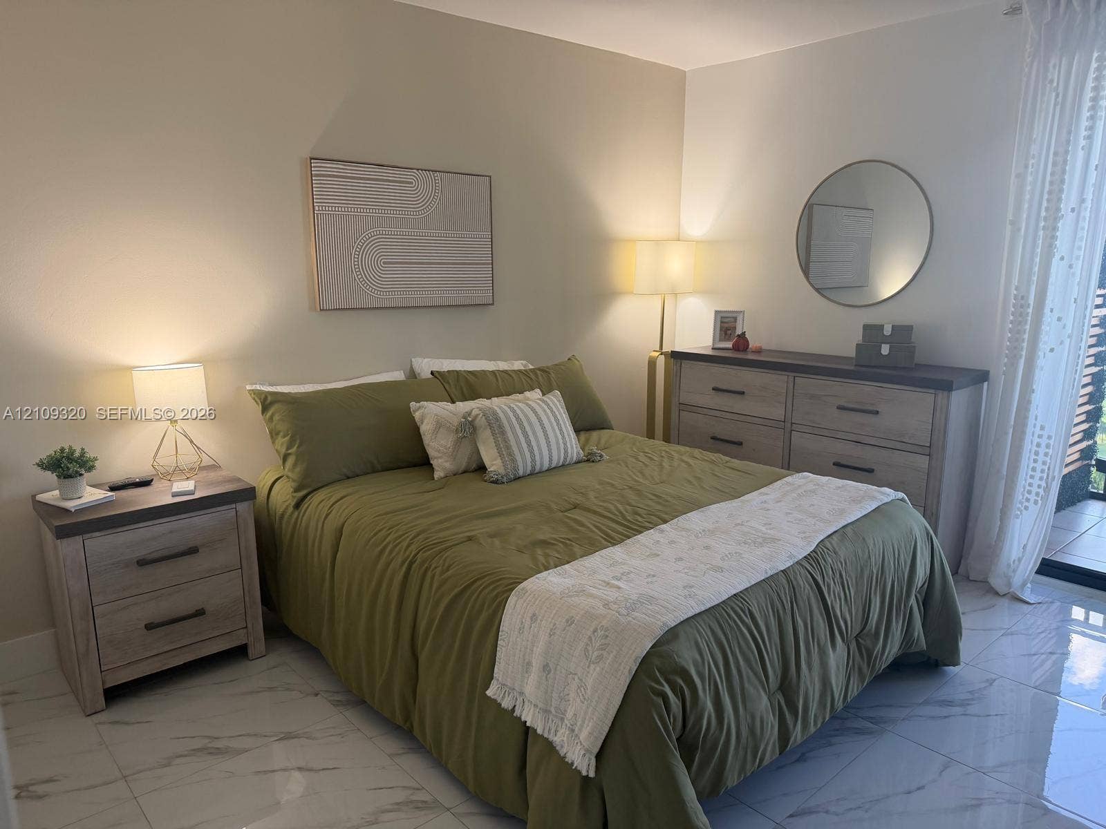 Neutral wall palette featuring polished stone-finish flooring and a glass balcony door