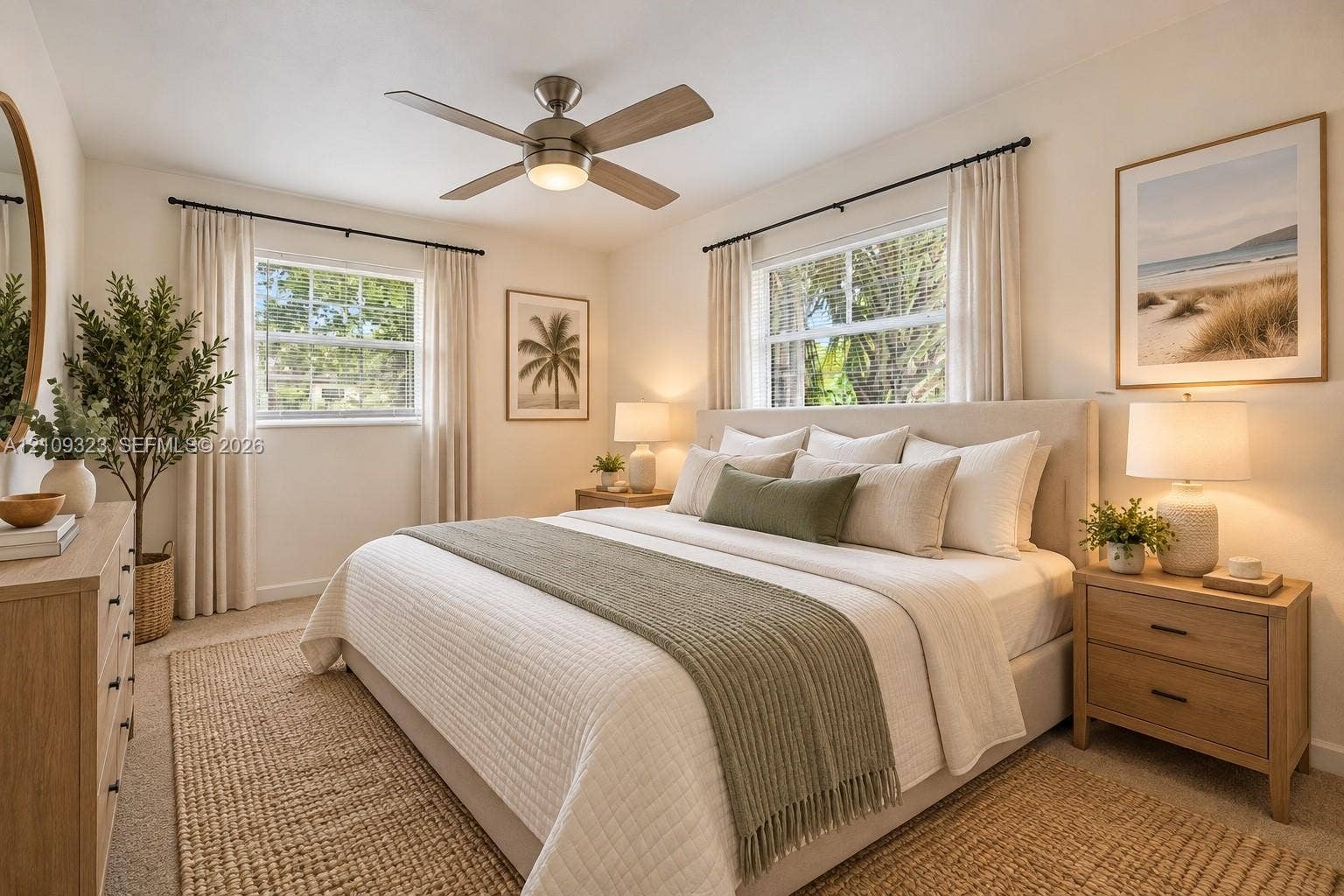 911 Shady Park Terrace, Daytona Beach, FL 32117 Neutral-toned bedroom featuring dual windows with curtain rods and a central brushed-nickel ceiling fan with integrated lighting