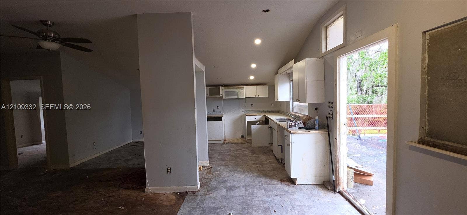 Kitchen featuring white cabinetry, recessed lighting, tile flooring, and a ceiling fan