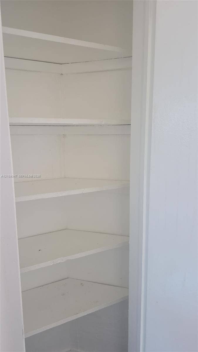 3128 SW 12th Place, #1-4, Fort Lauderdale, Fort Lauderdale, FL 33312 Built-in storage cabinet featuring five tiered shelves
