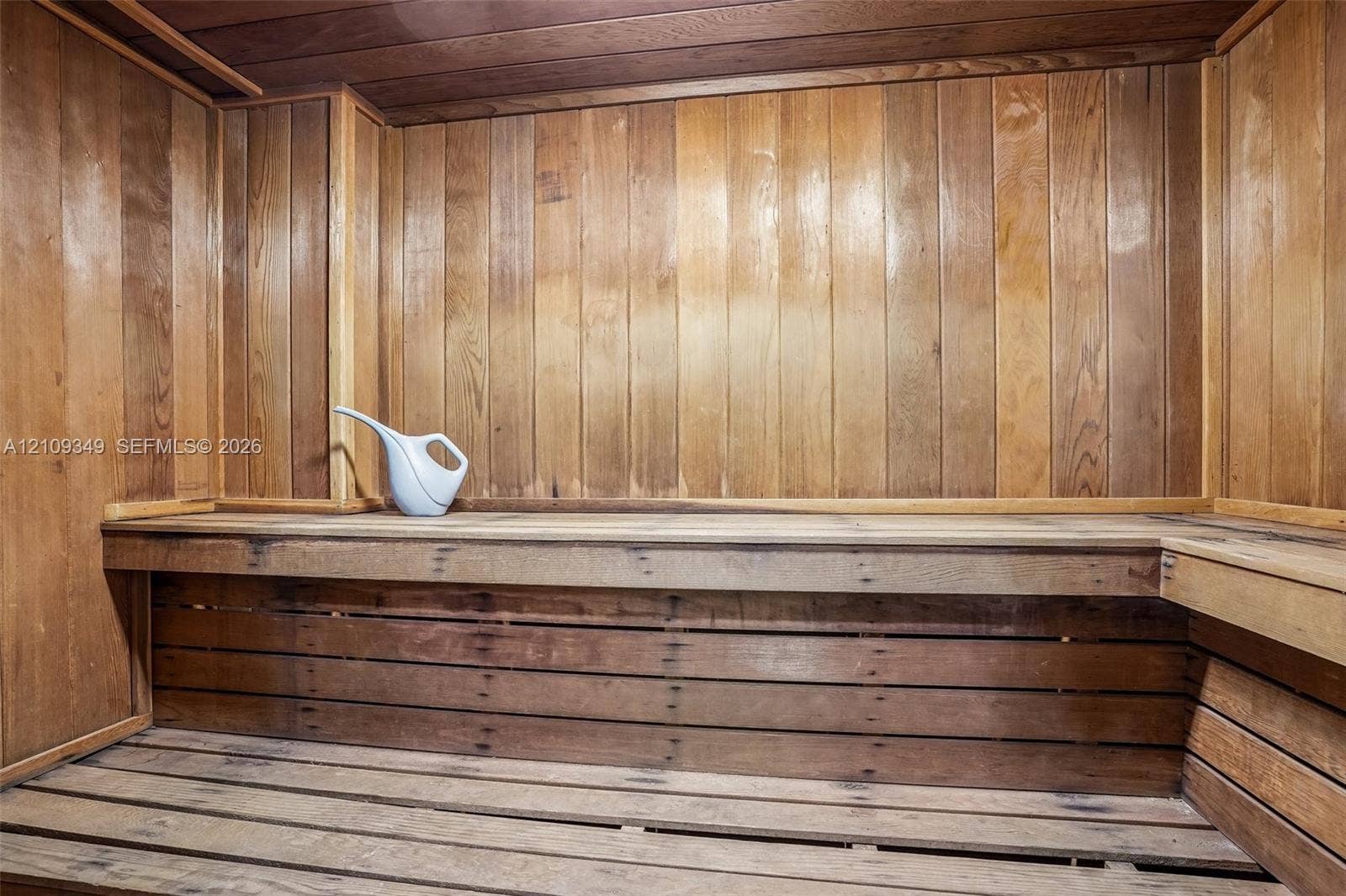 3115 S Atlantic Avenue, #G030, Daytona Beach, FL 32118 Sauna featuring wood-paneled walls, ceiling, and slatted wood bench seating