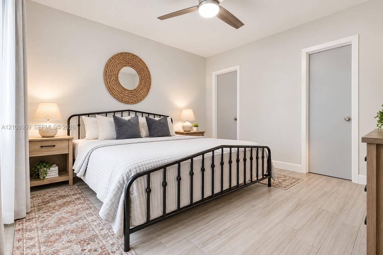 2426 SE 17th Causeway, #103A, Fort Lauderdale, FL 33316 Neutral wall color, wood-finish flooring, and a ceiling fan with integrated lighting