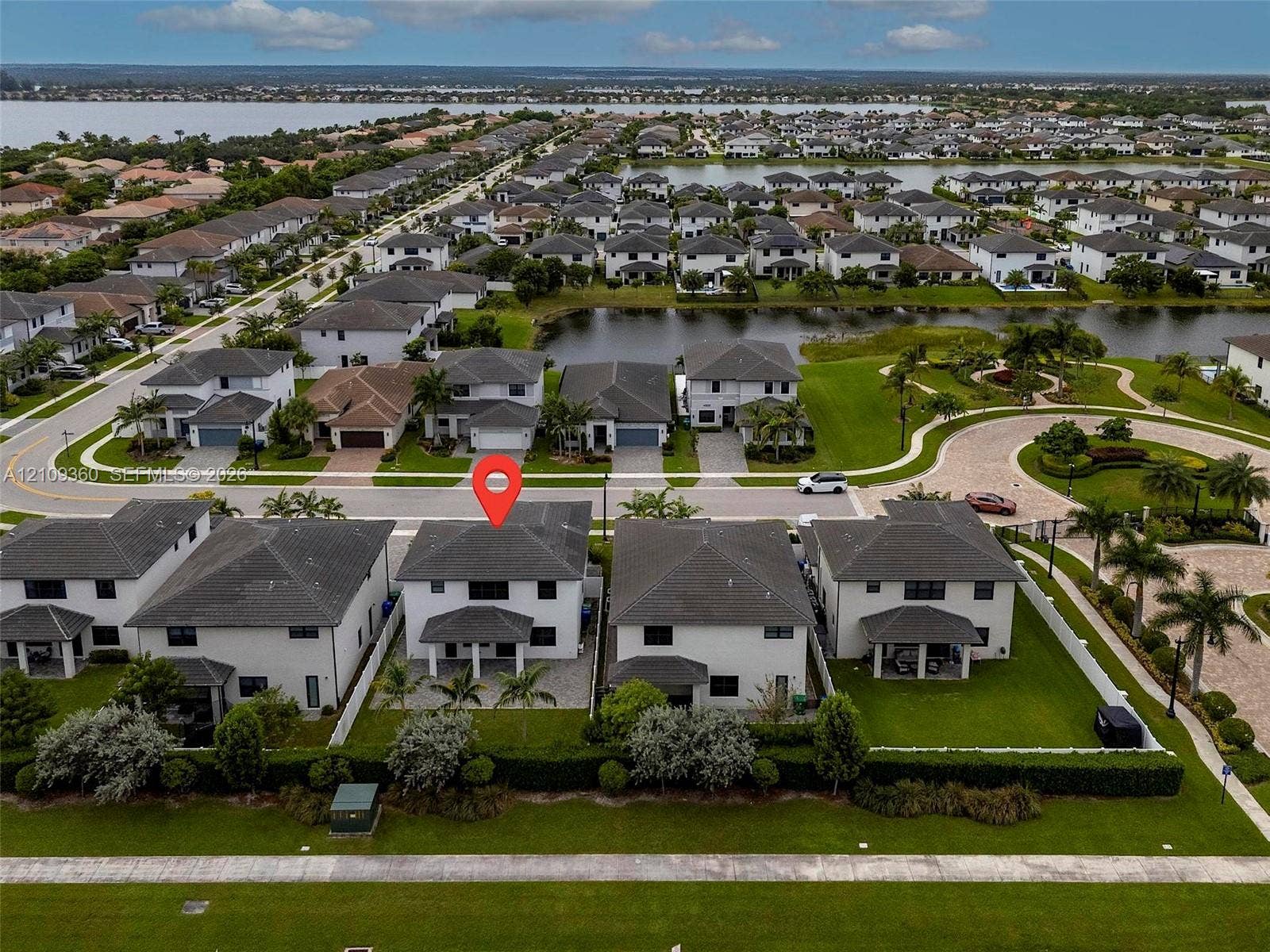 4535 SW 173rd Avenue, Miramar, FL 33029 Two-story residence featuring a hipped roof, covered rear patio, integrated two-car garage, and a fenced backyard