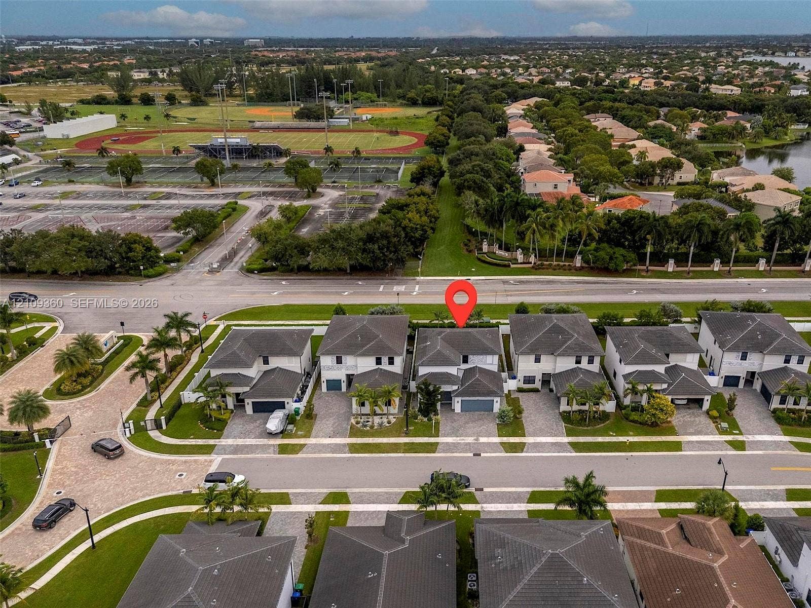 4535 SW 173rd Avenue, Miramar, FL 33029 Aerial perspective of a two-story residence featuring a multi-pitched roof, attached garage, paved driveway, and established community landscaping
