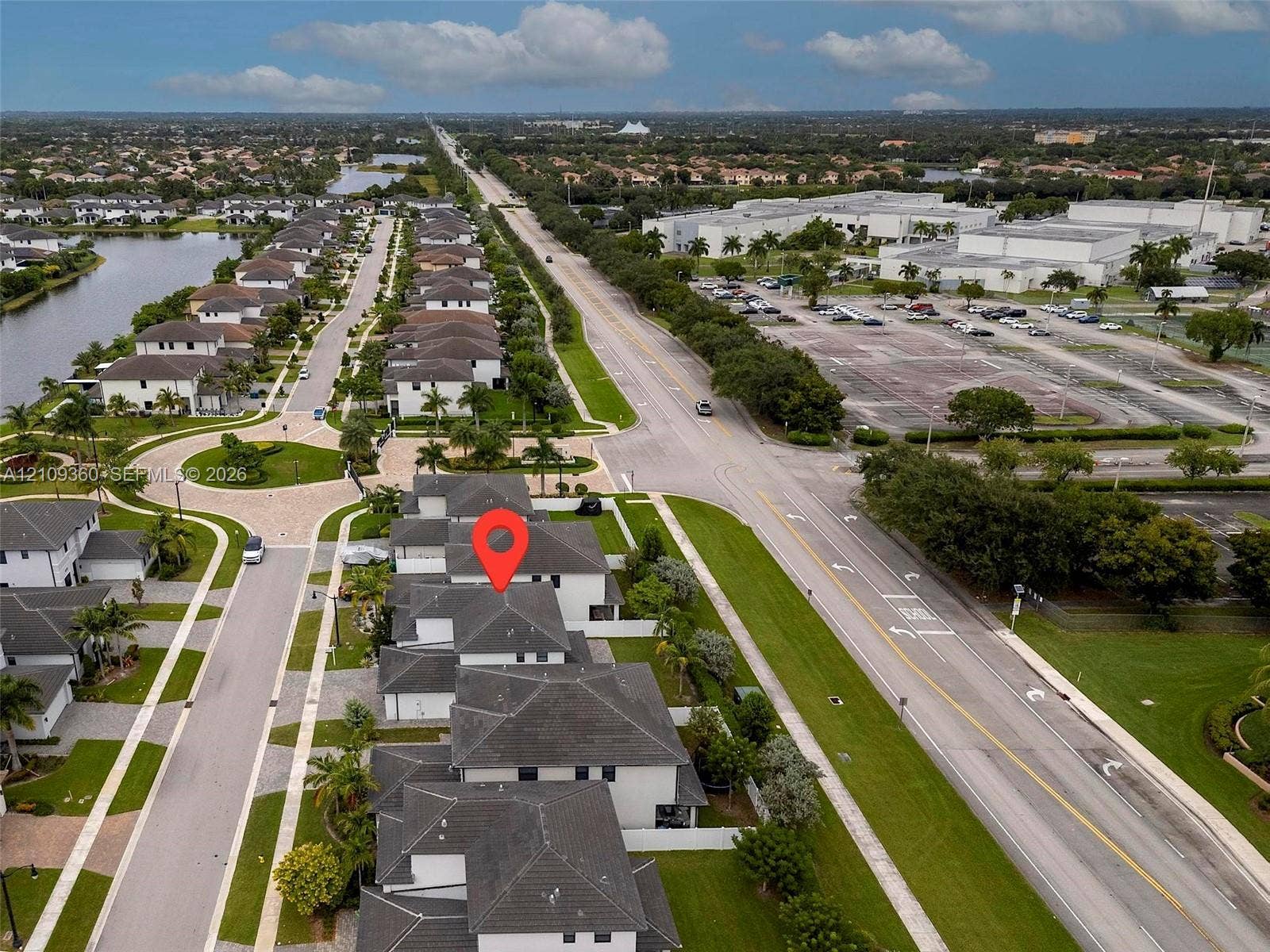 4535 SW 173rd Avenue, Miramar, FL 33029 Aerial perspective of a multi-structure residential complex featuring multi-pitch shingled roofing, paved streets, manicured lawn areas, and native landscaping