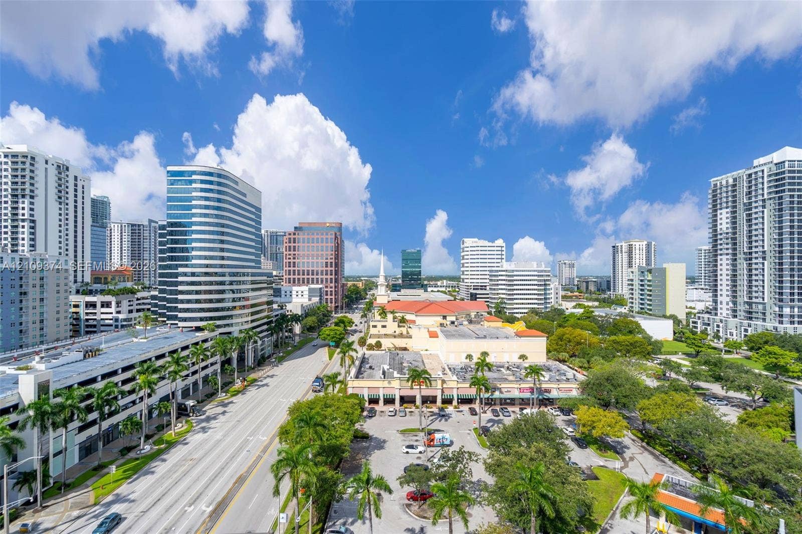 100 N Federal Highway, #1, Fort Lauderdale, FL 33301 Aerial perspective of the urban landscape featuring high-rise architecture, prominent city thoroughfares, and lush palm tree landscaping