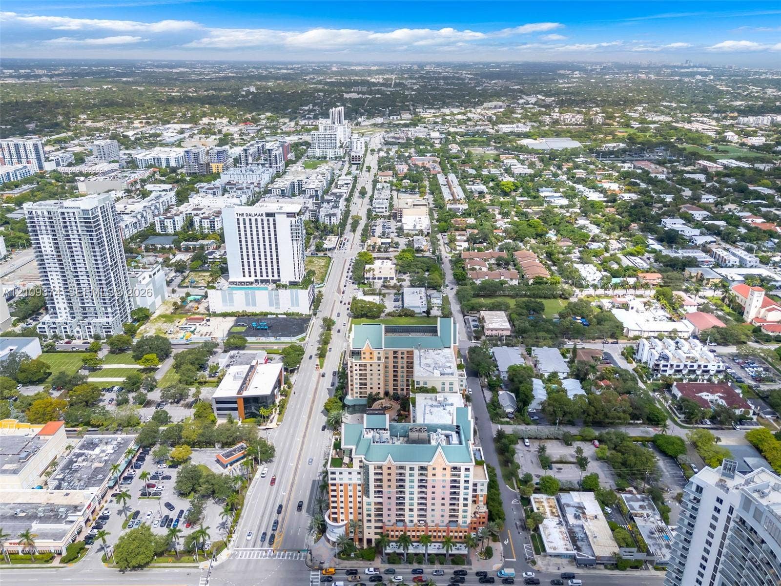 100 N Federal Highway, #1, Fort Lauderdale, FL 33301 Aerial perspective of a high-rise building complex featuring multi-story residential towers, a structured parking podium, and a central courtyard