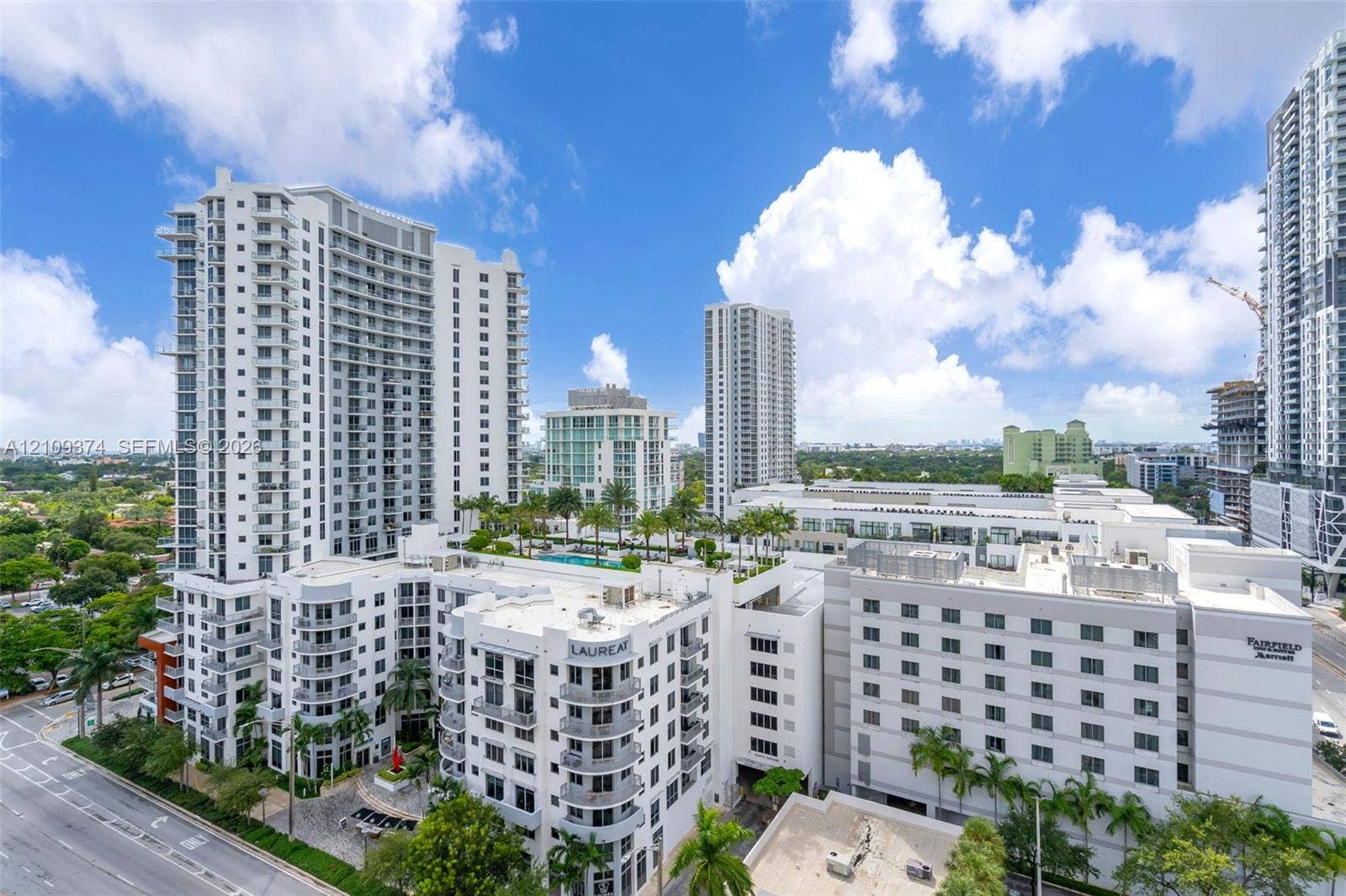 100 N Federal Highway, #1, Fort Lauderdale, FL 33301 High-rise residential building featuring expansive glass balconies, a multi-level architectural design, and a rooftop terrace with a swimming pool