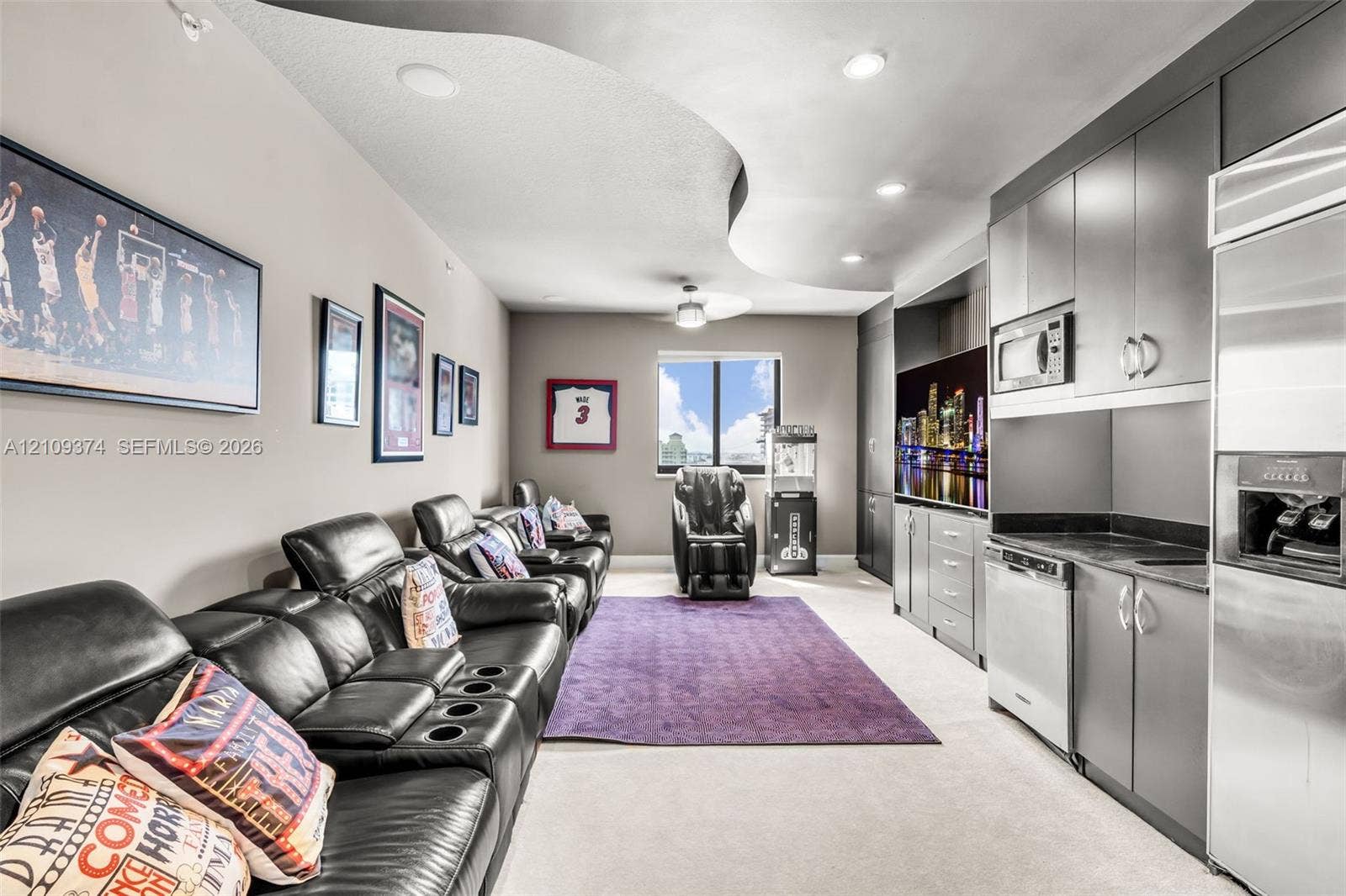 100 N Federal Highway, #1, Fort Lauderdale, FL 33301 Curved architectural ceiling detail with recessed lighting, integrated cabinetry, stainless steel kitchen appliances, and neutral wall-to-wall carpeting
